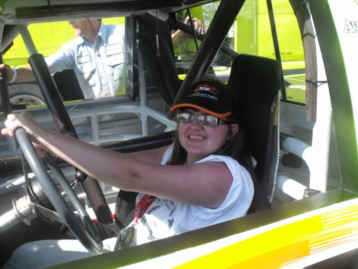 Me sitting in Matt Crafton's truck. Thanks to the total stranger who offered to take the photo for me