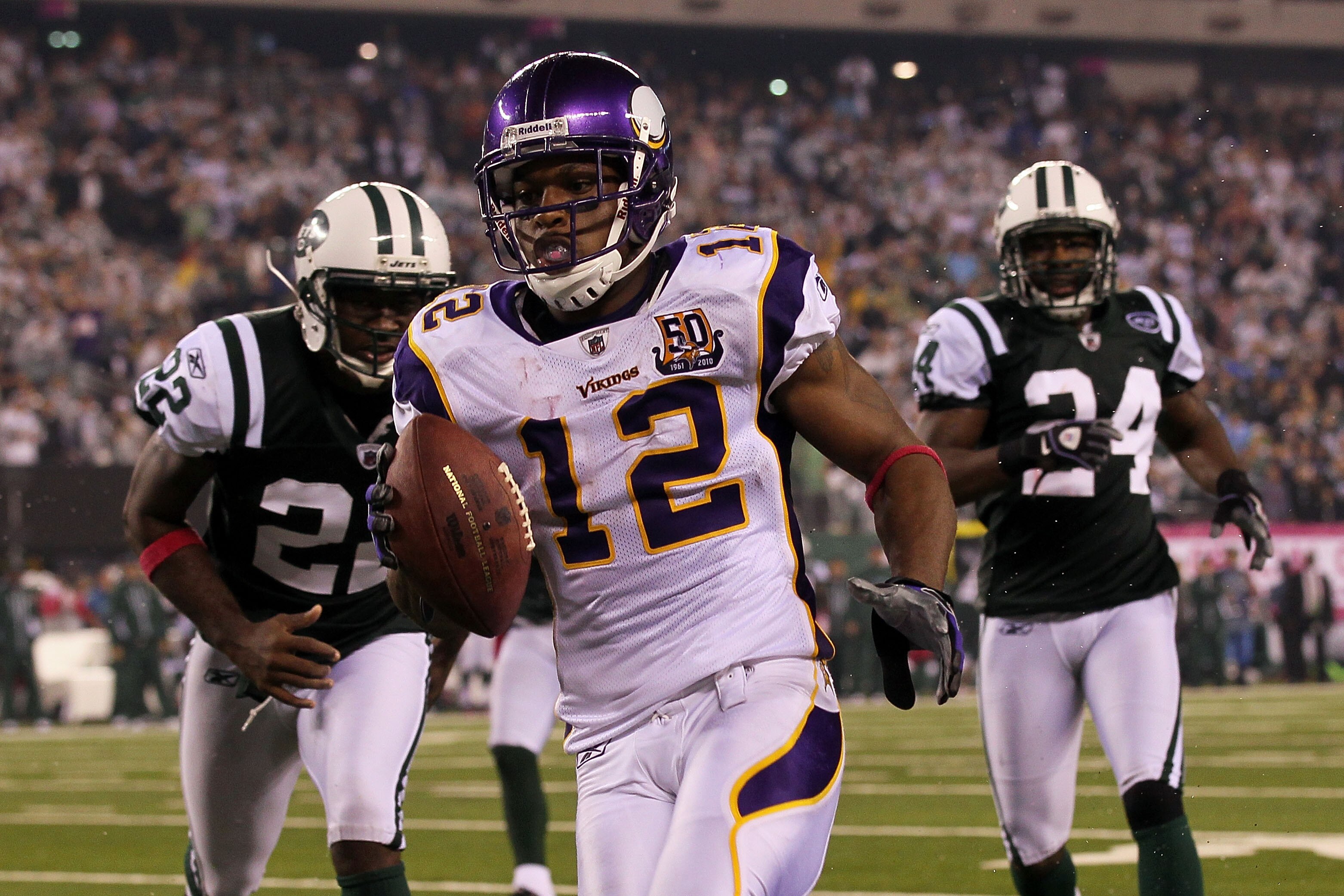 EAST RUTHERFORD, NJ - OCTOBER 11:  Percy Harvin #12 of the Minnesota Vikings scores a 34-yard touchdown reception in the fourth quarter against the New York Jets at New Meadowlands Stadium on October 11, 2010 in East Rutherford, New Jersey.  (Photo by Jim