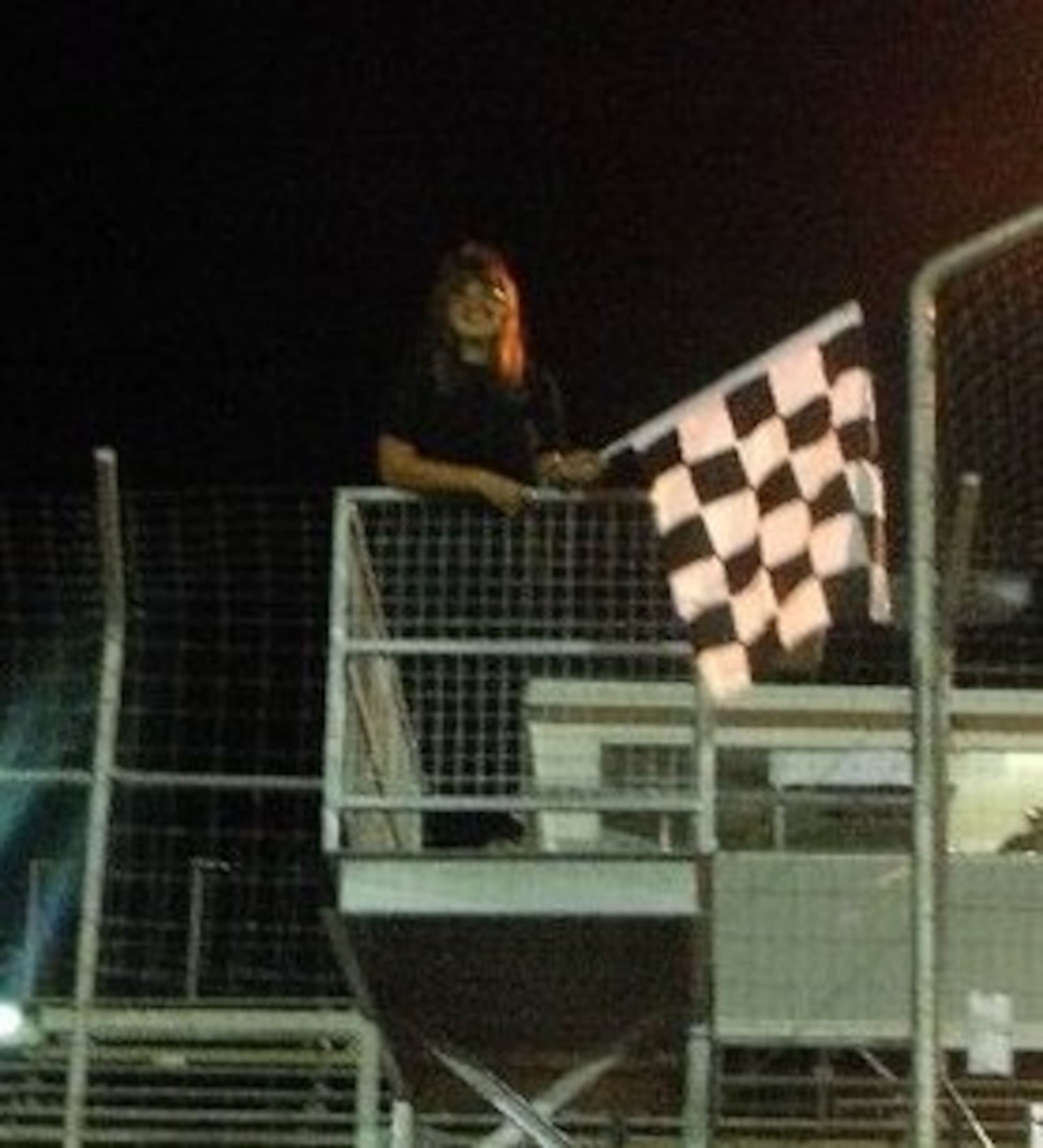Picture of me standing in the flag stand at Sunset Speedway / (C)Kristina Blinova