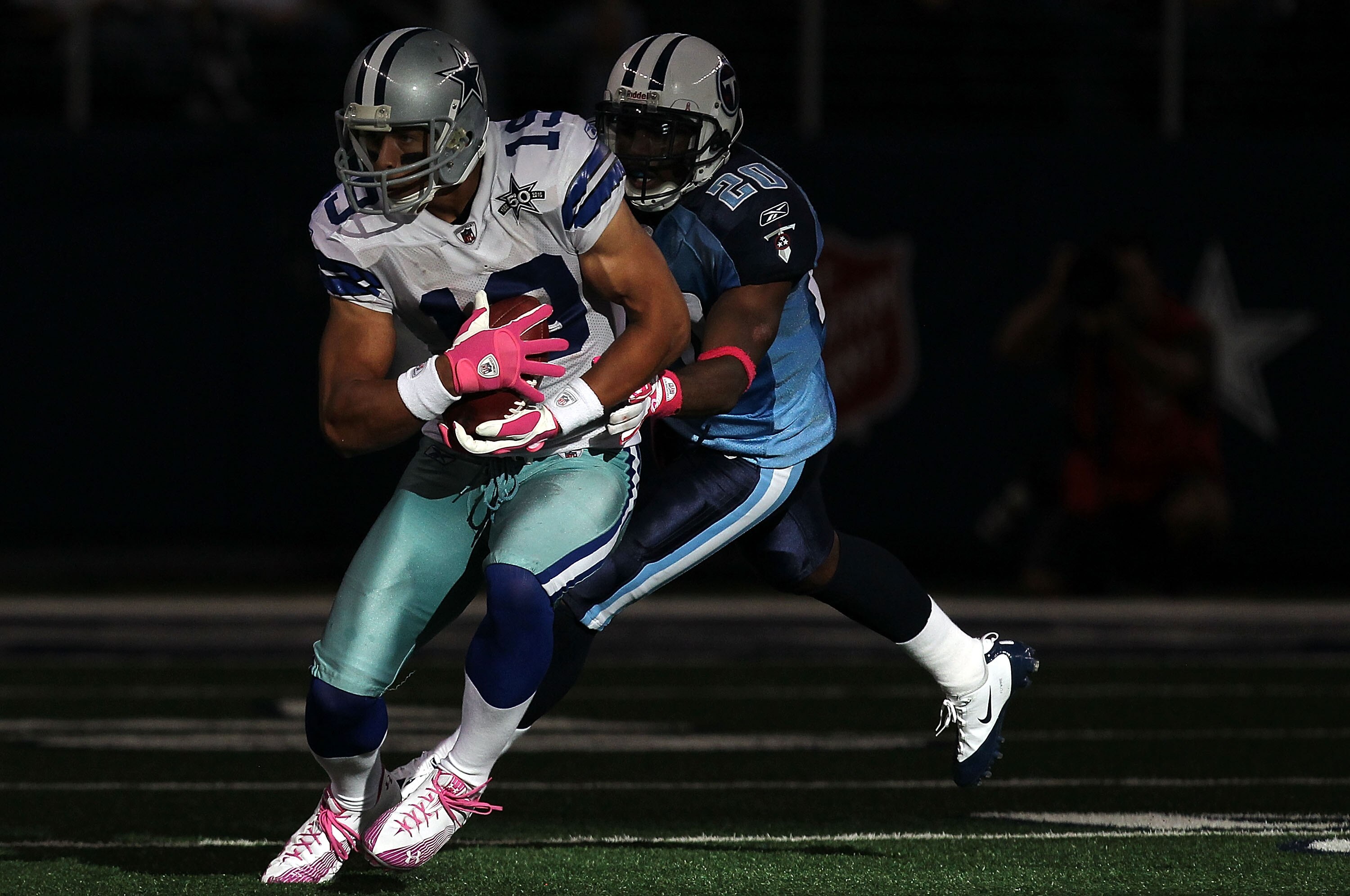 ARLINGTON, TX - OCTOBER 10:  Wide receiver Miles Austin #19 of the Dallas Cowboys runs the ball against Alterraun Verner #20 of the Tennessee Titans at Cowboys Stadium on October 10, 2010 in Arlington, Texas.  (Photo by Ronald Martinez/Getty Images)