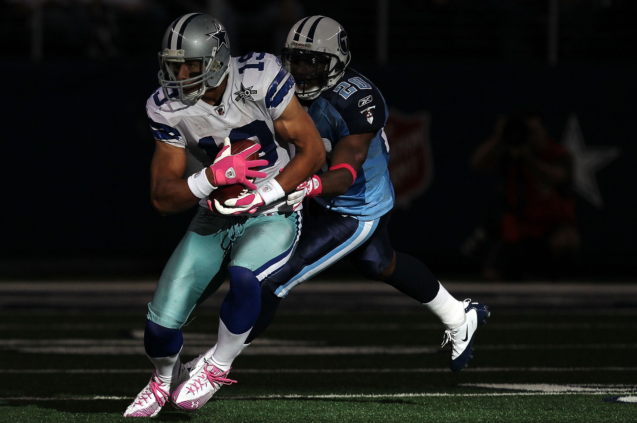 ARLINGTON, TX - OCTOBER 10: Wide receiver Miles Austin #19 of the Dallas Cowboys runs the ball against Alterraun Verner #20 of the Tennessee Titans at Cowboys Stadium on October 10, 2010 in Arlington, Texas. (Photo by Ronald Martinez/Getty Images) ARLINGTON, TX - OCTOBER 10: Wide receiver Miles Austin #19 of the Dallas Cowboys runs the ball against Alterraun Verner #20 of the Tennessee Titans at Cowboys Stadium on October 10, 2010 in Arlington, Texas. (Photo by Ronald Martinez/Getty Images)