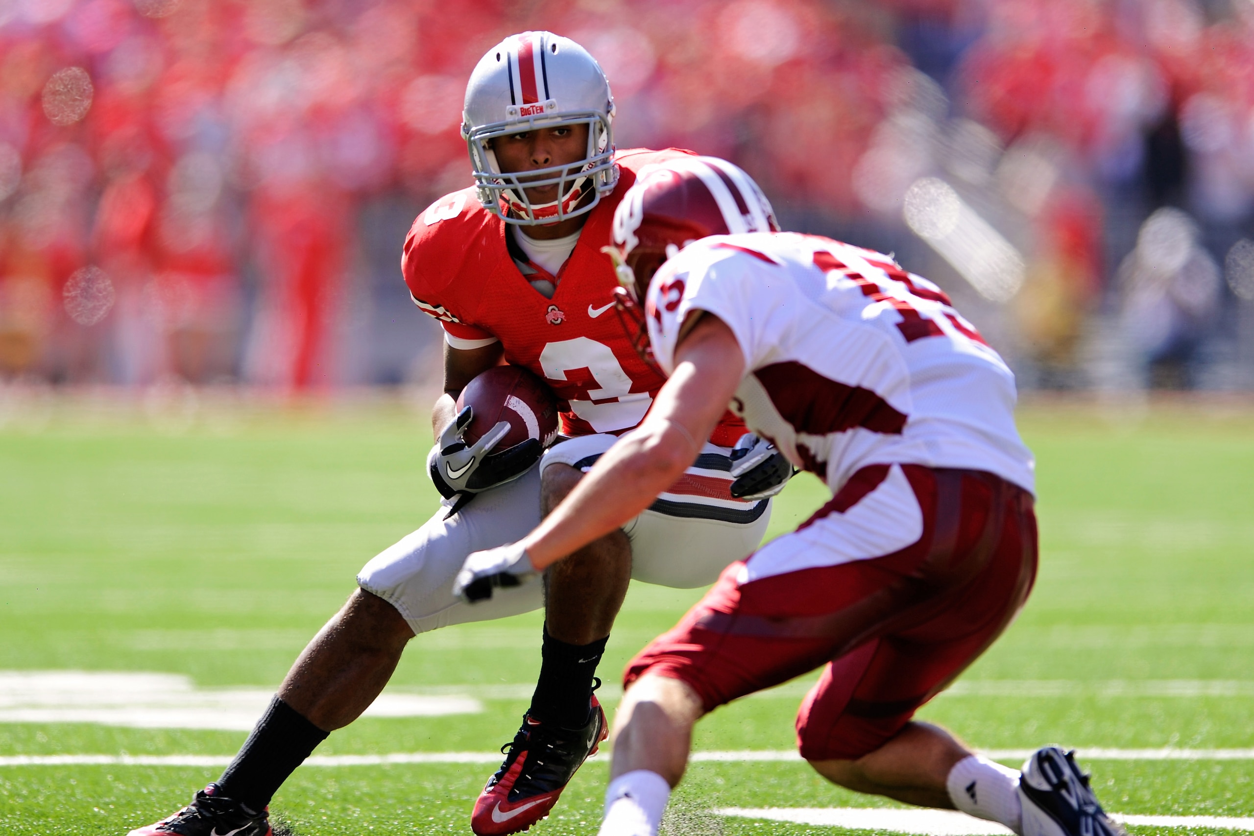 COLUMBUS, OH - OCTOBER 9:  Brandon Saine #3 of the Ohio State Buckeyes looks for running room after catching a pass as Matt Ernest #15 of the Indiana Hoosiers closes in for the tackle at Ohio Stadium on October 9, 2010 in Columbus, Ohio.  (Photo by Jamie