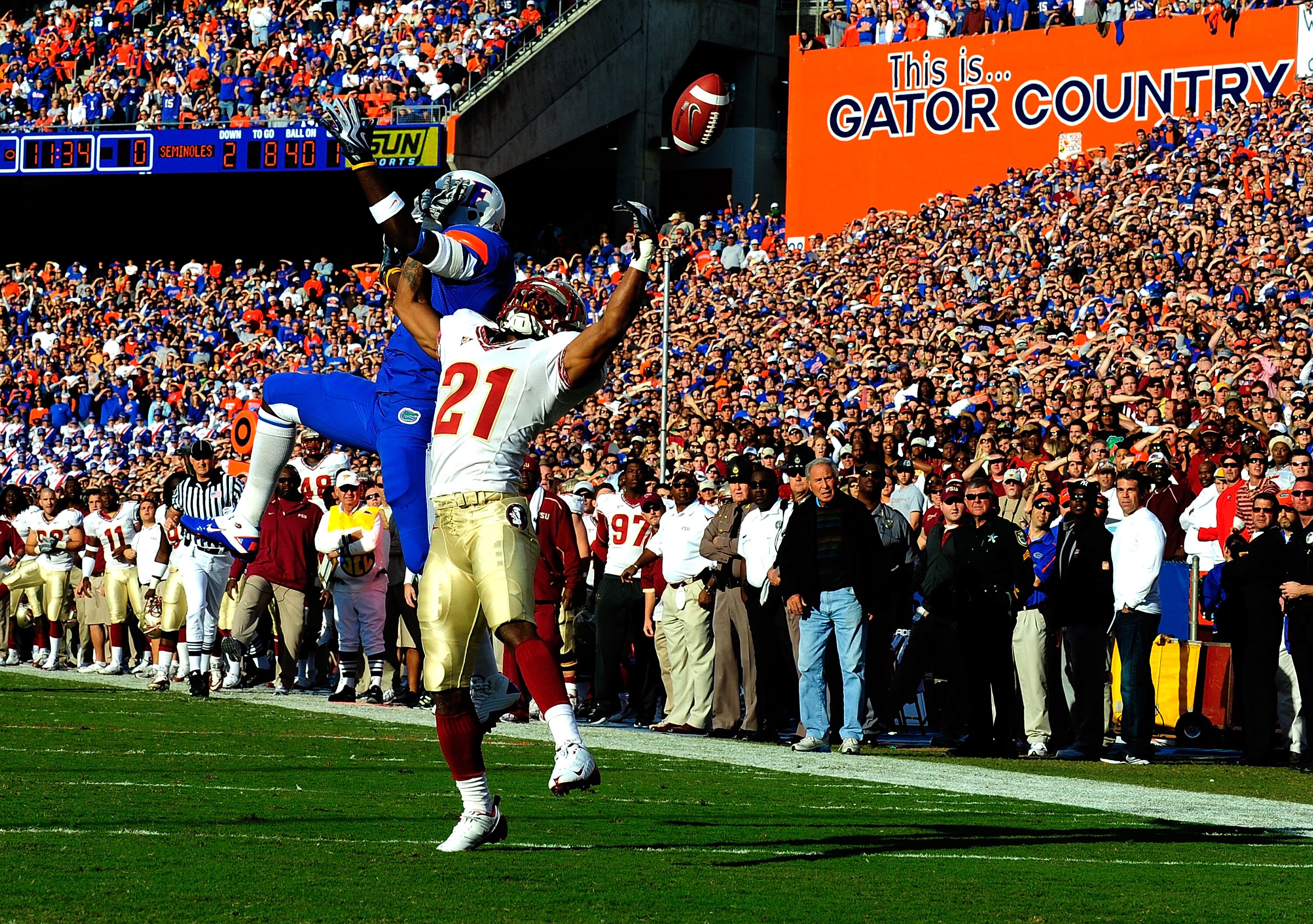 GAINESVILLE, FL - NOVEMBER 28:  Chris Rainey #3 of the Florida Gators attempts to catcha pass against Patrick Robinson #21 of the Florida State Seminoles at Ben Hill Griffin Stadium on November 28, 2009 in Gainesville, Florida.  (Photo by Sam Greenwood/Ge
