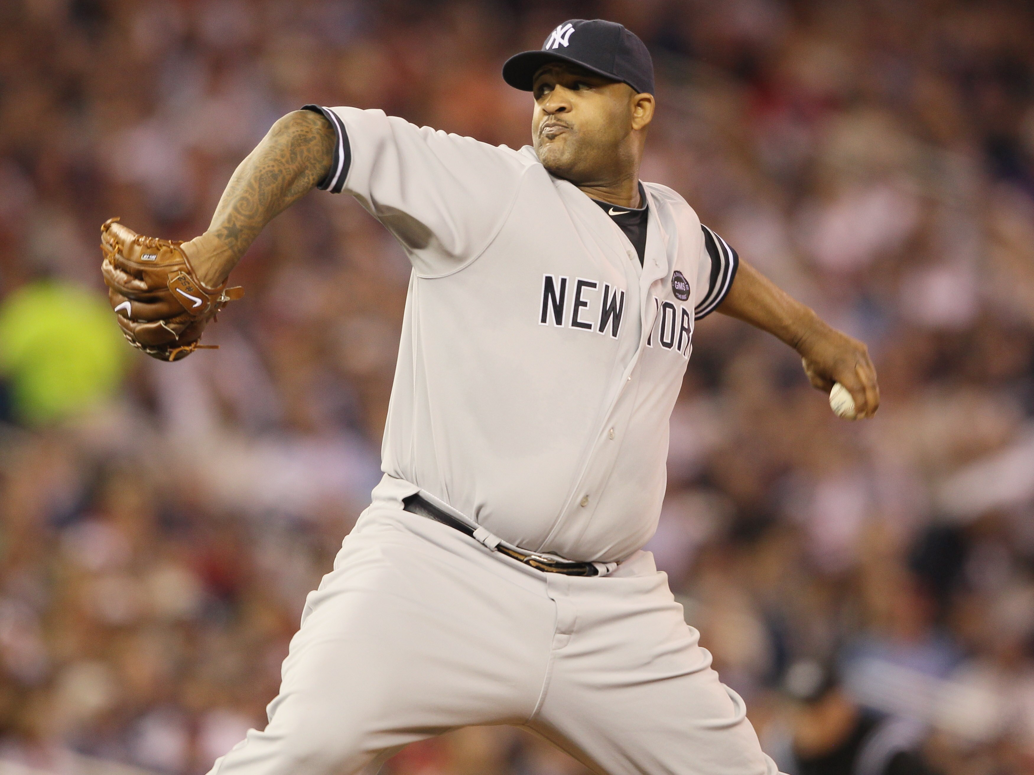 MINNEAPOLIS - OCTOBER 06:  CC Sabathia #52 of the New York Yankees delivers a pitch in the second inning against the Minnesota Twins during game one of the ALDS on October 6, 2010 at Target Field in Minneapolis, Minnesota.  (Photo by Elsa/Getty Images)