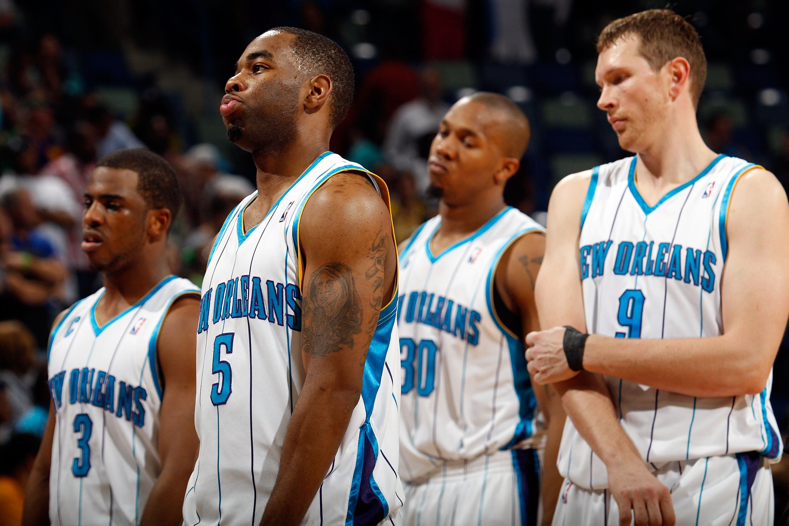 NEW ORLEANS - MARCH 31:  Members of the New Orleans Hornets react to losing to the Washington Wizards 96-91 at New Orleans Arena on March 31, 2010 in New Orleans, Louisiana.  NOTE TO USER: User expressly acknowledges and agrees that, by downloading and/or