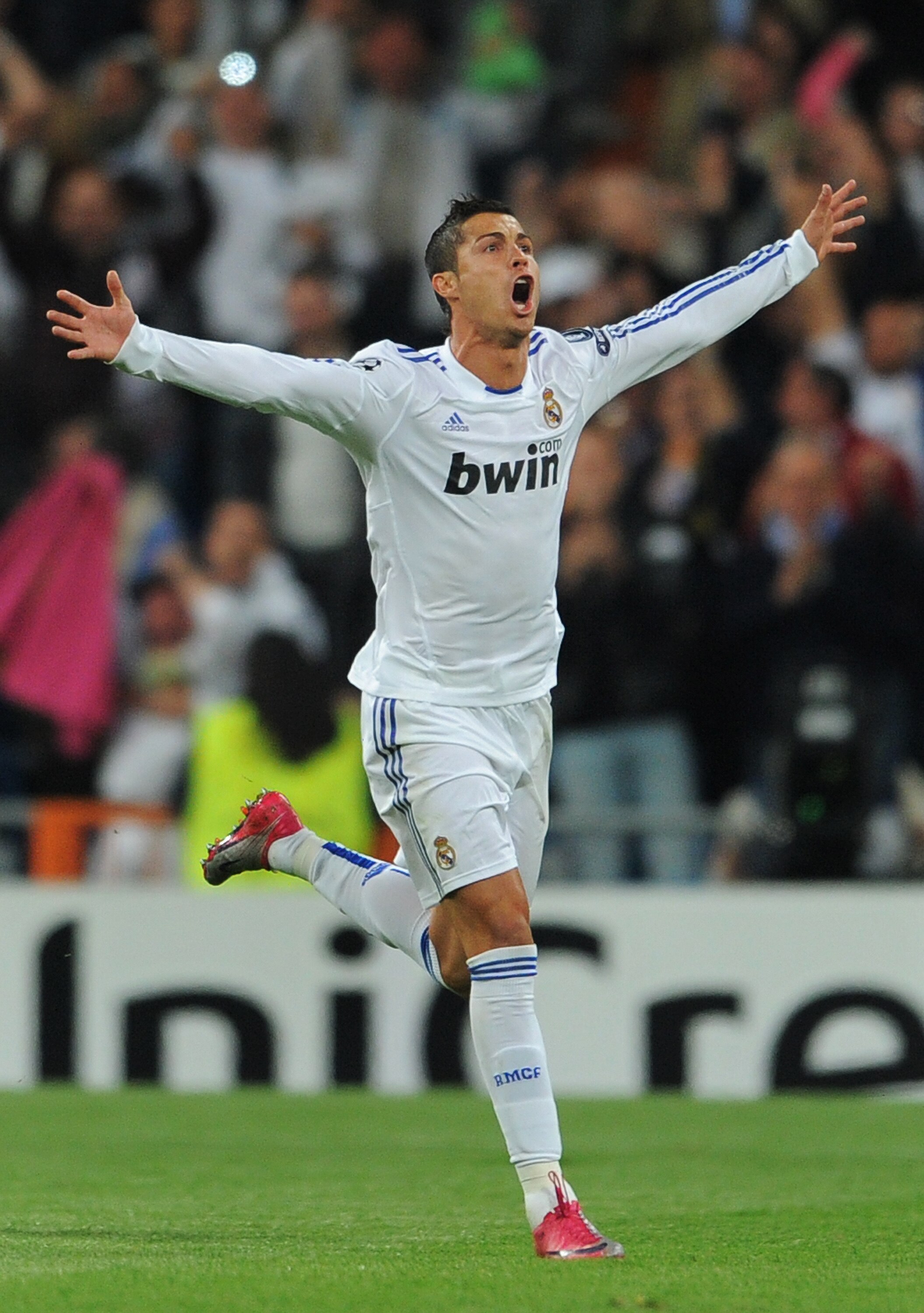 MADRID, SPAIN - OCTOBER 19:  Cristiano Ronaldo of Real Madrid celebrates scoring his sides opening goal from a free kick during the UEFA Champions League group G match between Real Madrid and AC Milan at the Estadio Santiago Bernabeu on October 19, 2010 i