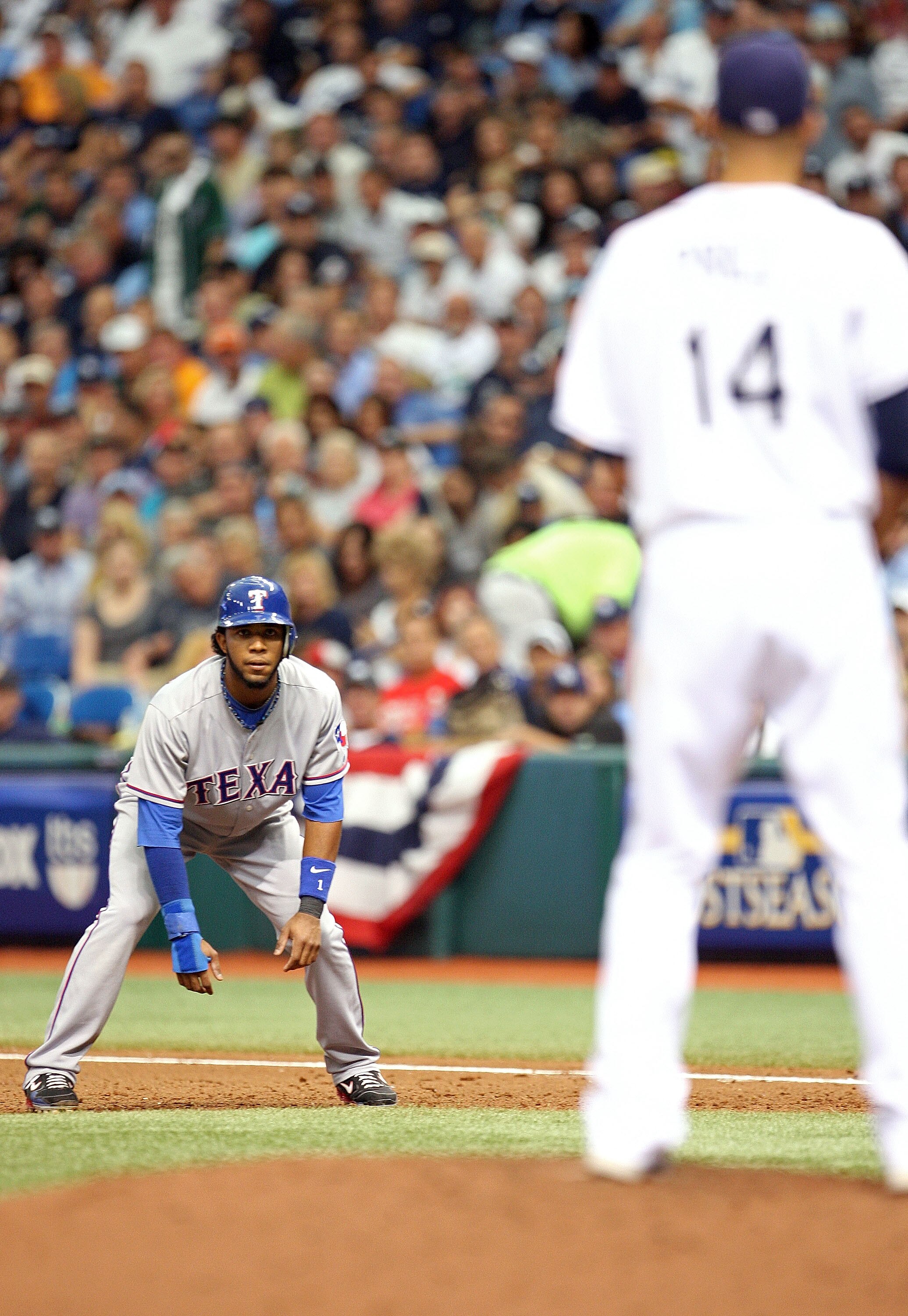 ST. PETERSBURG - OCTOBER 06: Elvis Andrus #1 of the Texas Rangers leads off first against pitcher David Price #14 during Game 1 of the ALDS against the Tampa Bay Rays at Tropicana Field on October 6, 2010 in St. Petersburg, Florida.  (Photo by Mike Ehrman
