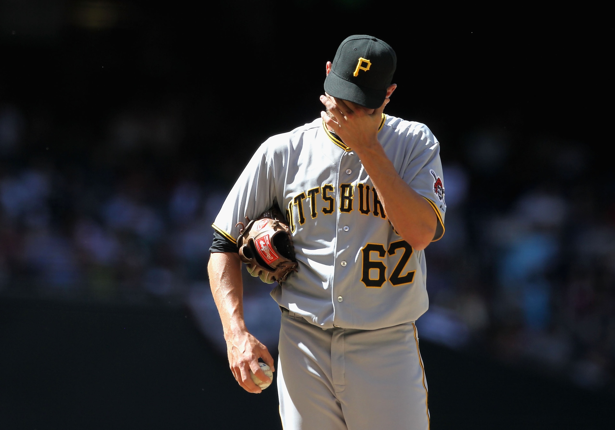 PHOENIX - APRIL 11:  Relief pitcher Hayden Penn #62 of the Pittsburgh Pirates reacts after giving up a run to the Arizona Diamondbacks during the fourth inning of the major league baseball game at Chase Field on April 11, 2010 in Phoenix, Arizona.  (Photo