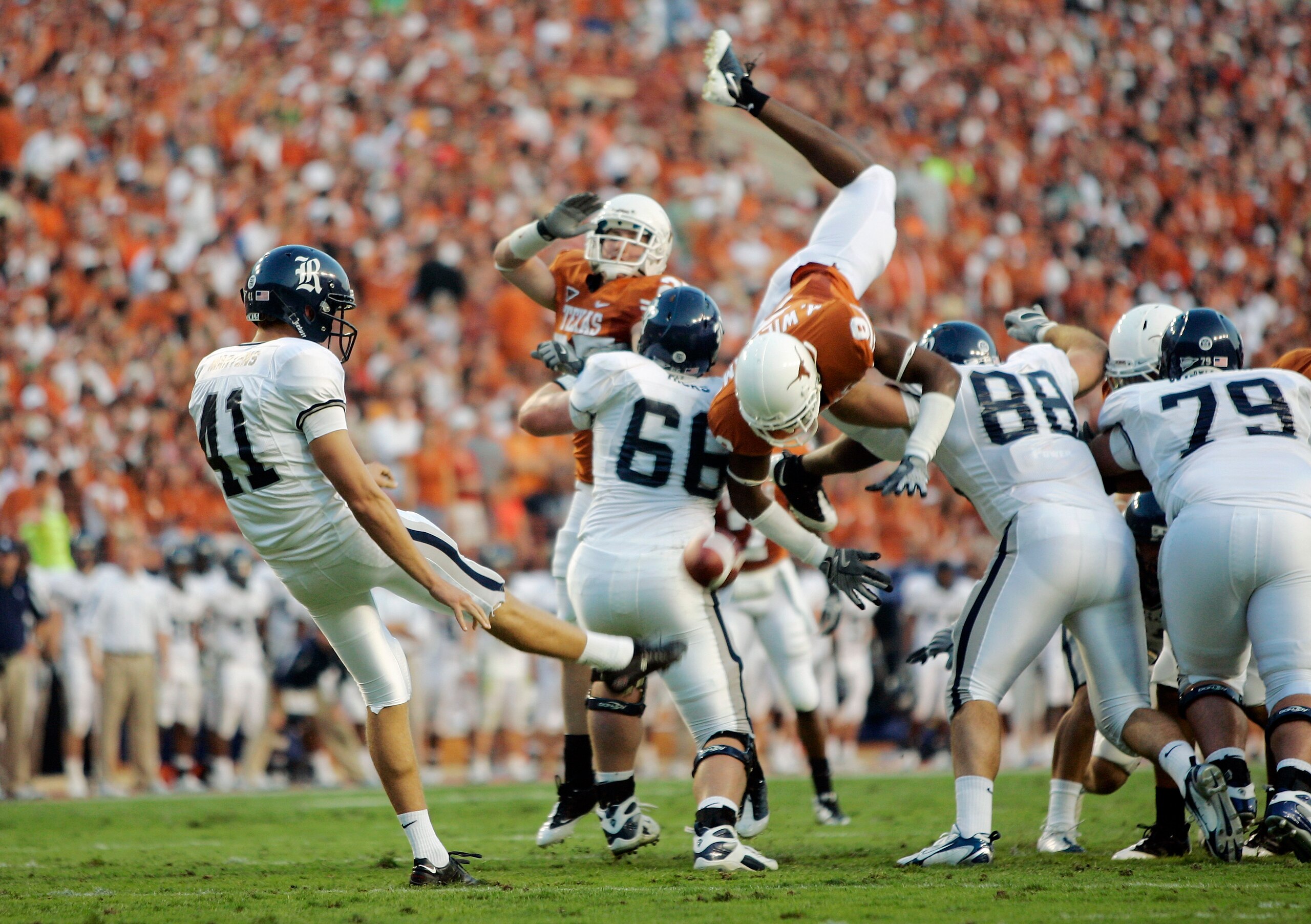 AUSTIN, TX - SEPTEMBER 20: Malcolm Williams #9 of the Texas Longhorns tries to block a punt by Kyle Martens #41 of the Rice Owls in the second quarter on September 20, 2008 at Darrell K Royal-Texas Memorial Stadium in Austin, Texas.  (Photo by Brian Bahr/