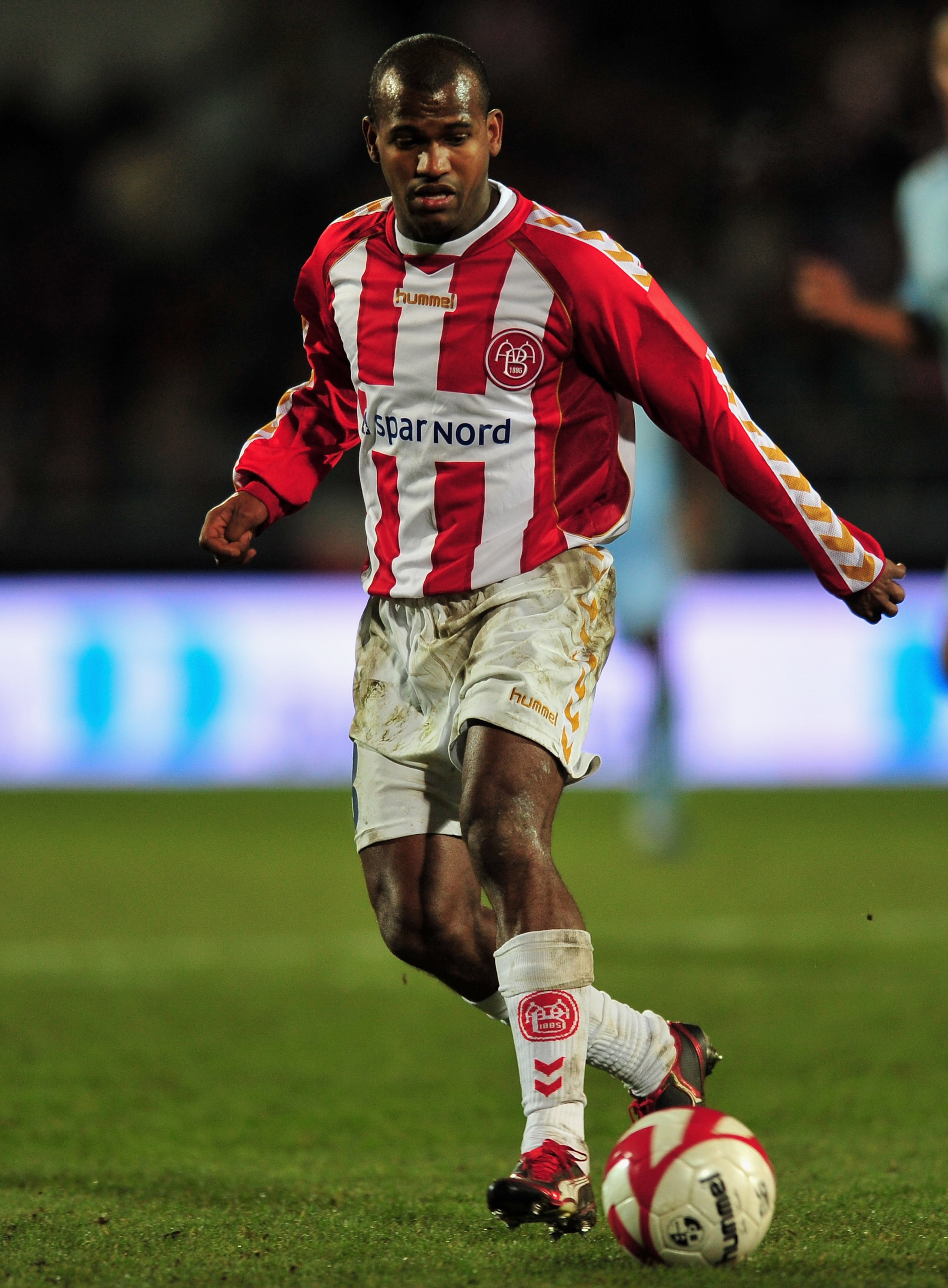 AALBORG, DENMARK - MARCH 19:  Marcus Tracy of Aalborg runs with the ball during the UEFA Cup, Round of 16, Second Leg match between Aalborg and Manchester City on March 19, 2009 in Aalborg, Denmark.  (Photo by Stuart Franklin/Getty Images)