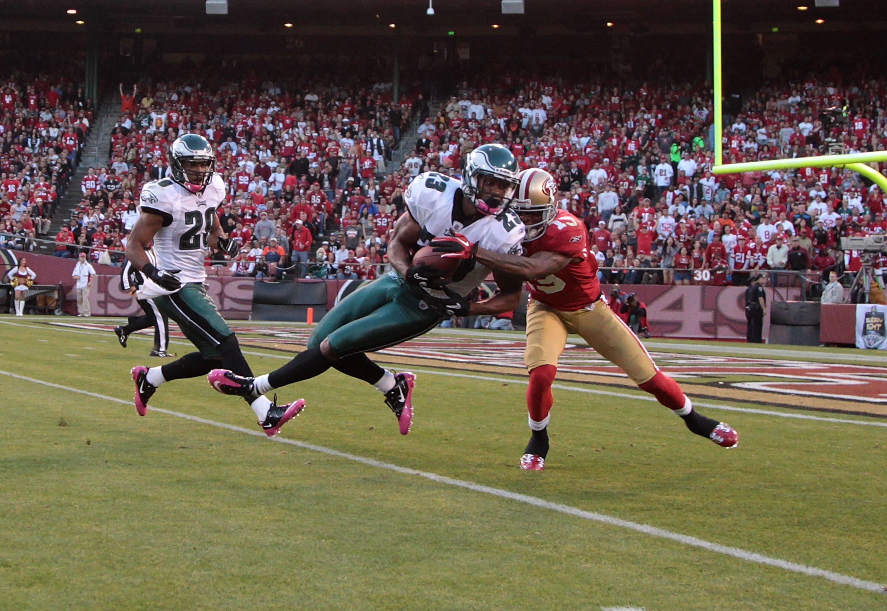SAN FRANCISCO - OCTOBER 10:  Dimitri Patterson #23 of the Philadelphia Eagles intercepts the ball past Ted Ginn #19 of the San Francisco 49ers during an NFL game at Candlestick Park on October 10, 2010 in San Francisco, California.  (Photo by Jed Jacobsoh