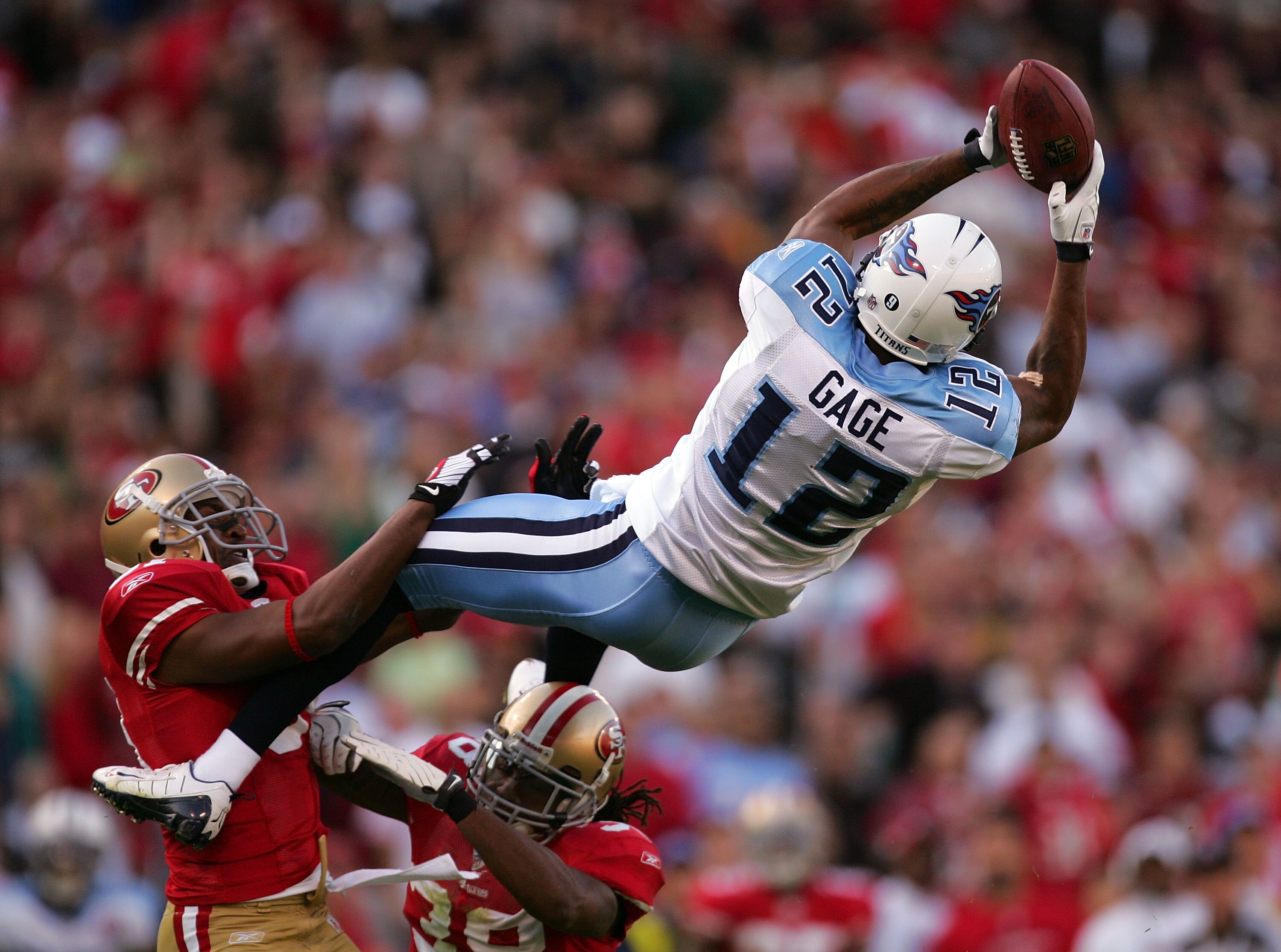 SAN FRANCISCO - NOVEMBER 08:  Justin Gage #12 of the Tennessee Titans leaps to catch a ball against the San Francisco 49ers at Candlestick Park on November 8, 2009 in San Francisco, California.  (Photo by Ezra Shaw/Getty Images)