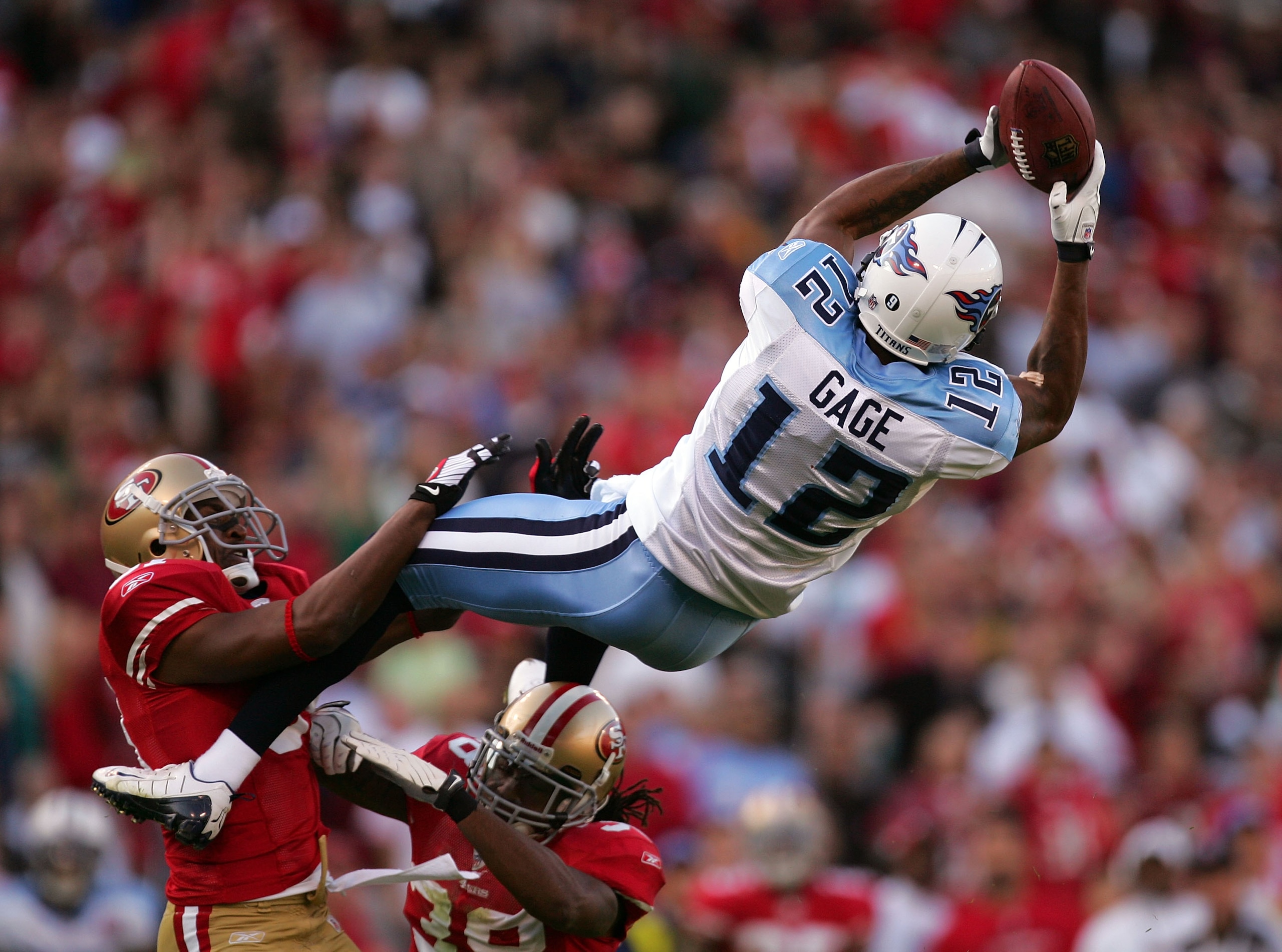 SAN FRANCISCO - NOVEMBER 08:  Justin Gage #12 of the Tennessee Titans leaps to catch a ball against the San Francisco 49ers at Candlestick Park on November 8, 2009 in San Francisco, California.  (Photo by Ezra Shaw/Getty Images)