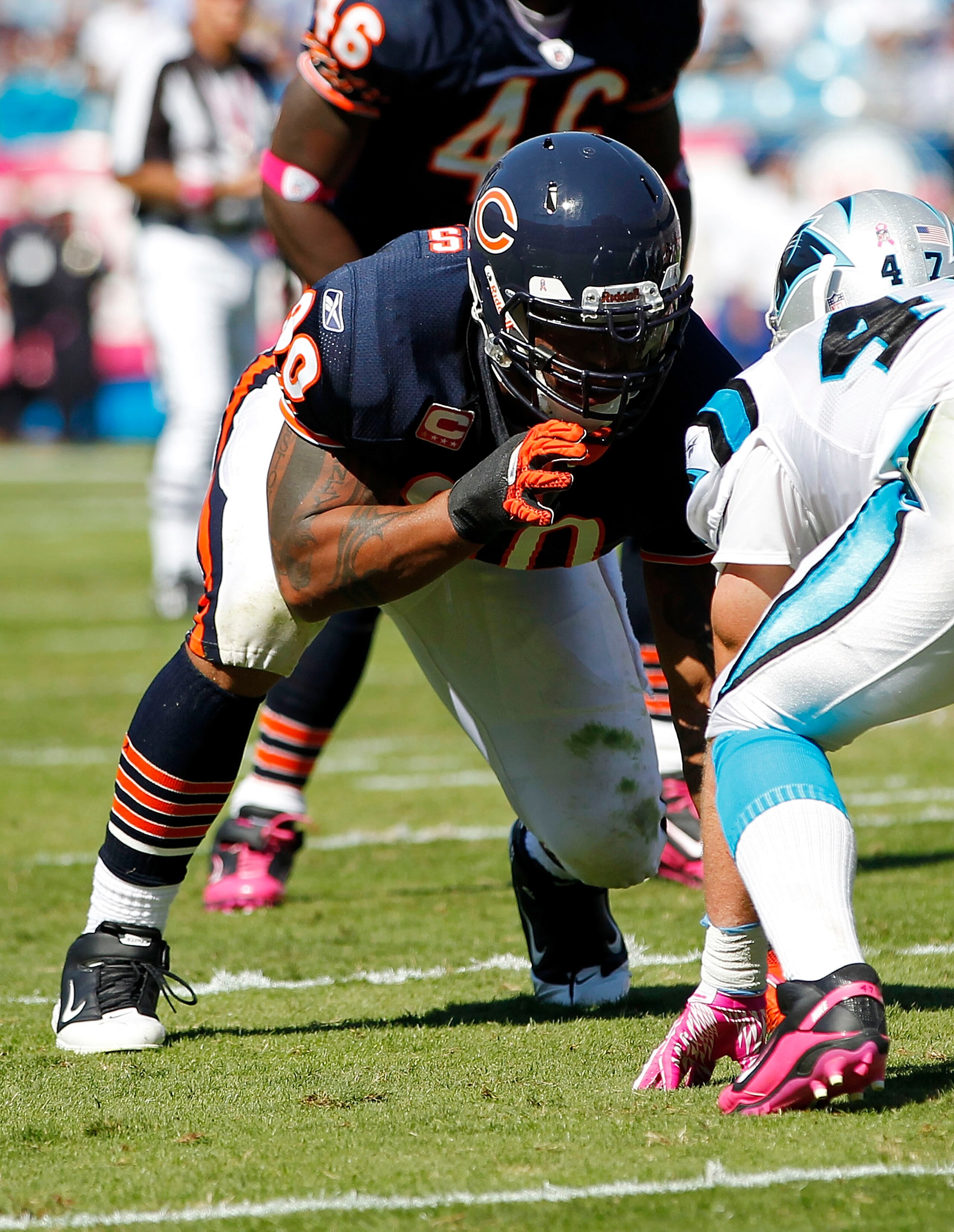 CHARLOTTE, NC - OCTOBER 10: Defensive end Julius Peppers #90 of the Chicago Bears lines up against tight end Jeff King #47 of the Carolina Panthers at Bank of America Stadium on October 10, 2010 in Charlotte, North Carolina. (Photo by Geoff Burke/Getty Im