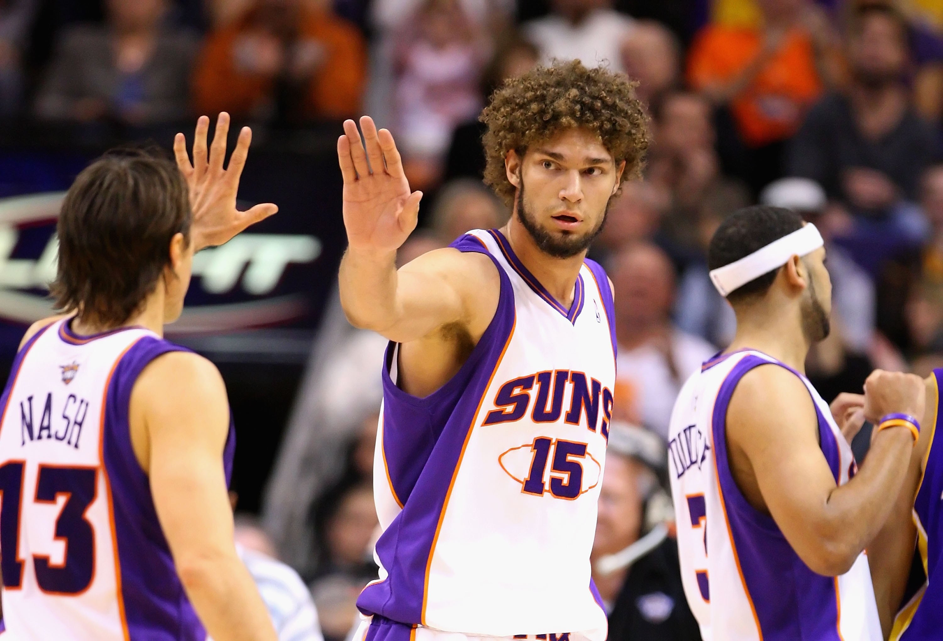 PHOENIX - DECEMBER 28:  Robin Lopez #15 and Steve Nash #13 of the Phoenix Suns high five during the NBA game against the Los Angeles Lakers at US Airways Center on December 28, 2009 in Phoenix, Arizona. The Suns defeated the Lakers 118-103. NOTE TO USER: