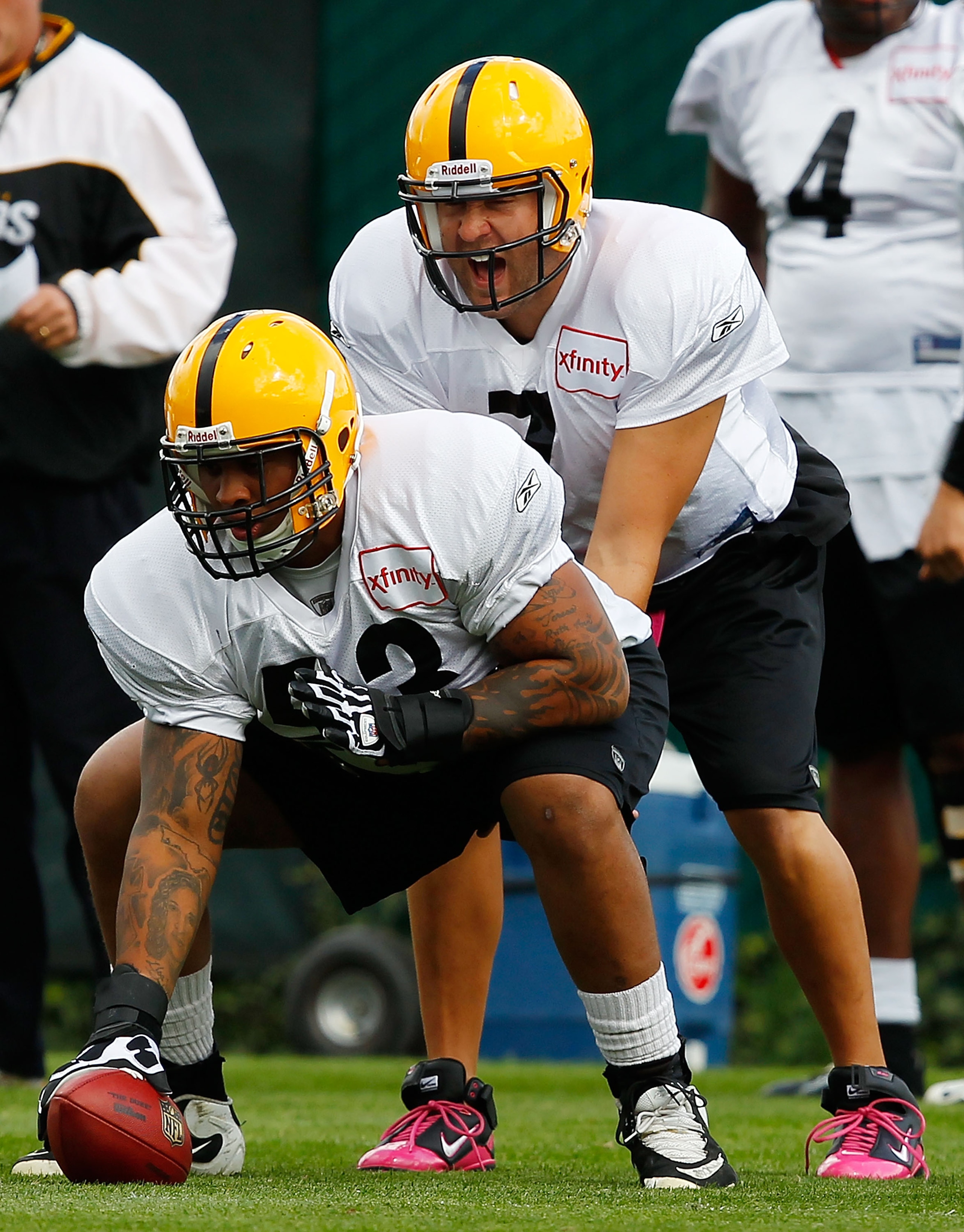 PITTSBURGH - OCTOBER 14:  Ben Roethlisberger #7 of the Pittsburgh Steelers takes a snap from teammate Maurkice Pouncey #53 during practice at the Pittsburgh Steelers South Side training facility on October 14, 2010 in Pittsburgh, Pennsylvania.  (Photo by 