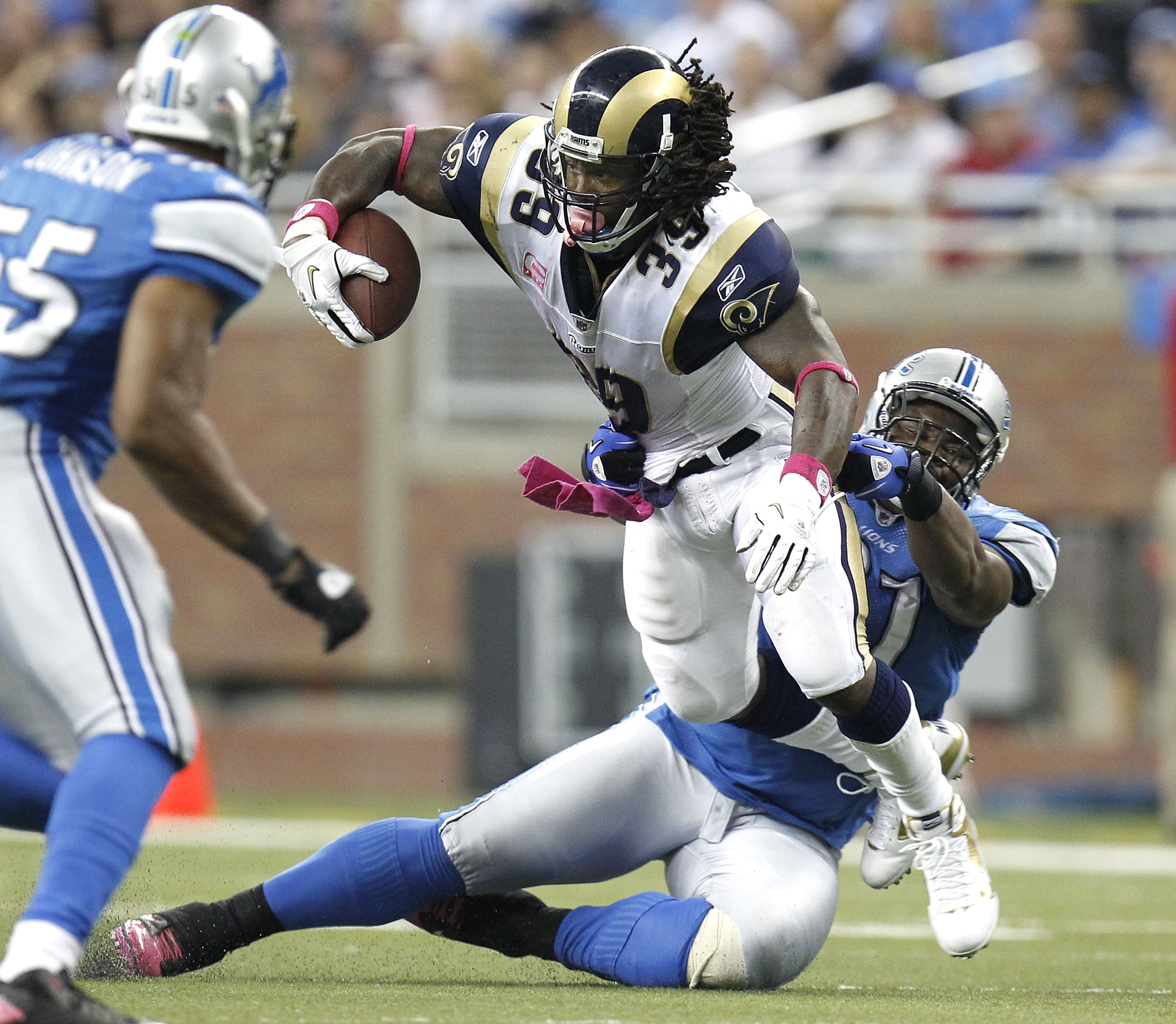 DETROIT - OCTOBER 10: Steven Jackson #39 of the St. Louis Rams tries to escape Sammie Hill #91 of the Detroit Lions on October 10, 2010 at Ford Field in Detroit, Michigan. Detroit won the game 44-6. (Photo by Gregory Shamus/Getty Images)