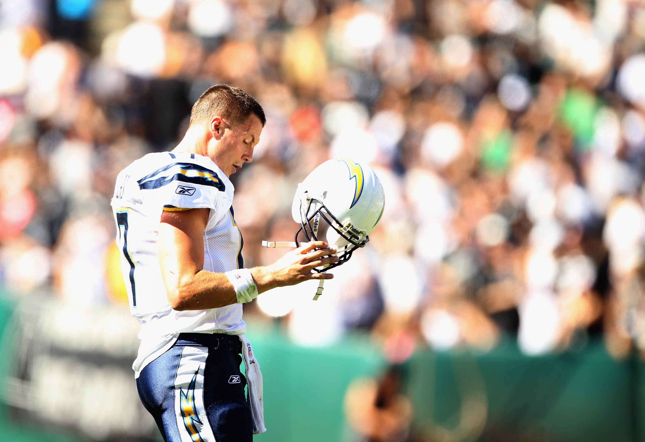 OAKLAND, CA - OCTOBER 10:  Philip Rivers #17 of the San Diego Chargers walks off the field after the Chargers fumbled the ball against the Oakland Raiders at Oakland-Alameda County Coliseum on October 10, 2010 in Oakland, California.  (Photo by Ezra Shaw/