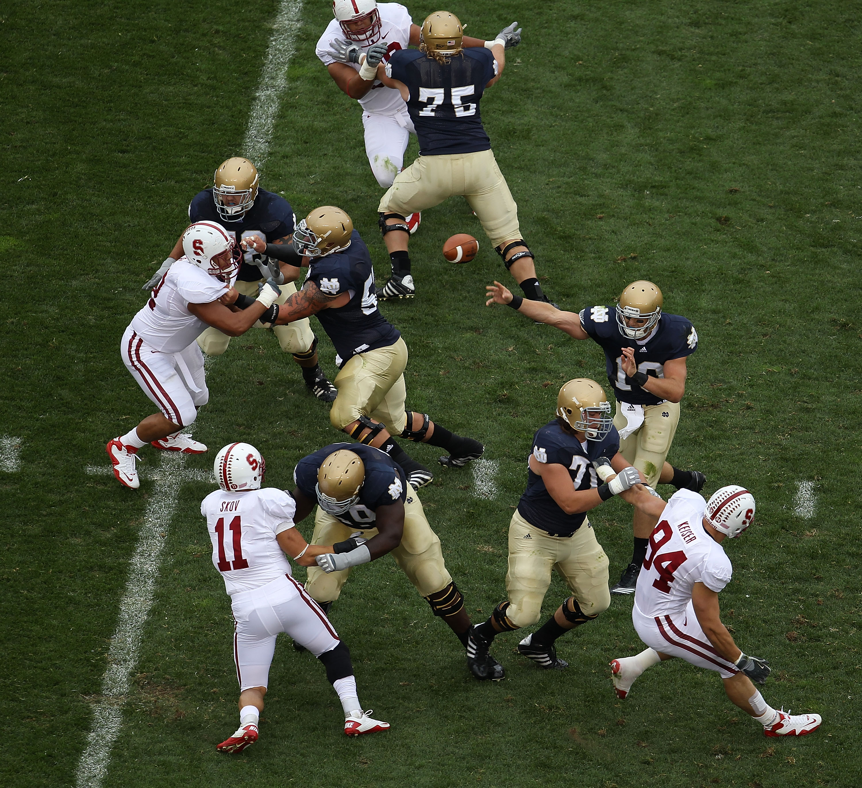 SOUTH BEND, IN - SEPTEMBER 25: Dayne Crist #10 of the Notre Dame Fighting Irish passes the ball as his offensive line blocks against the Stanford Cardinal defense at Notre Dame Stadium on September 25, 2010 in South Bend, Indiana. (Photo by Jonathan Danie