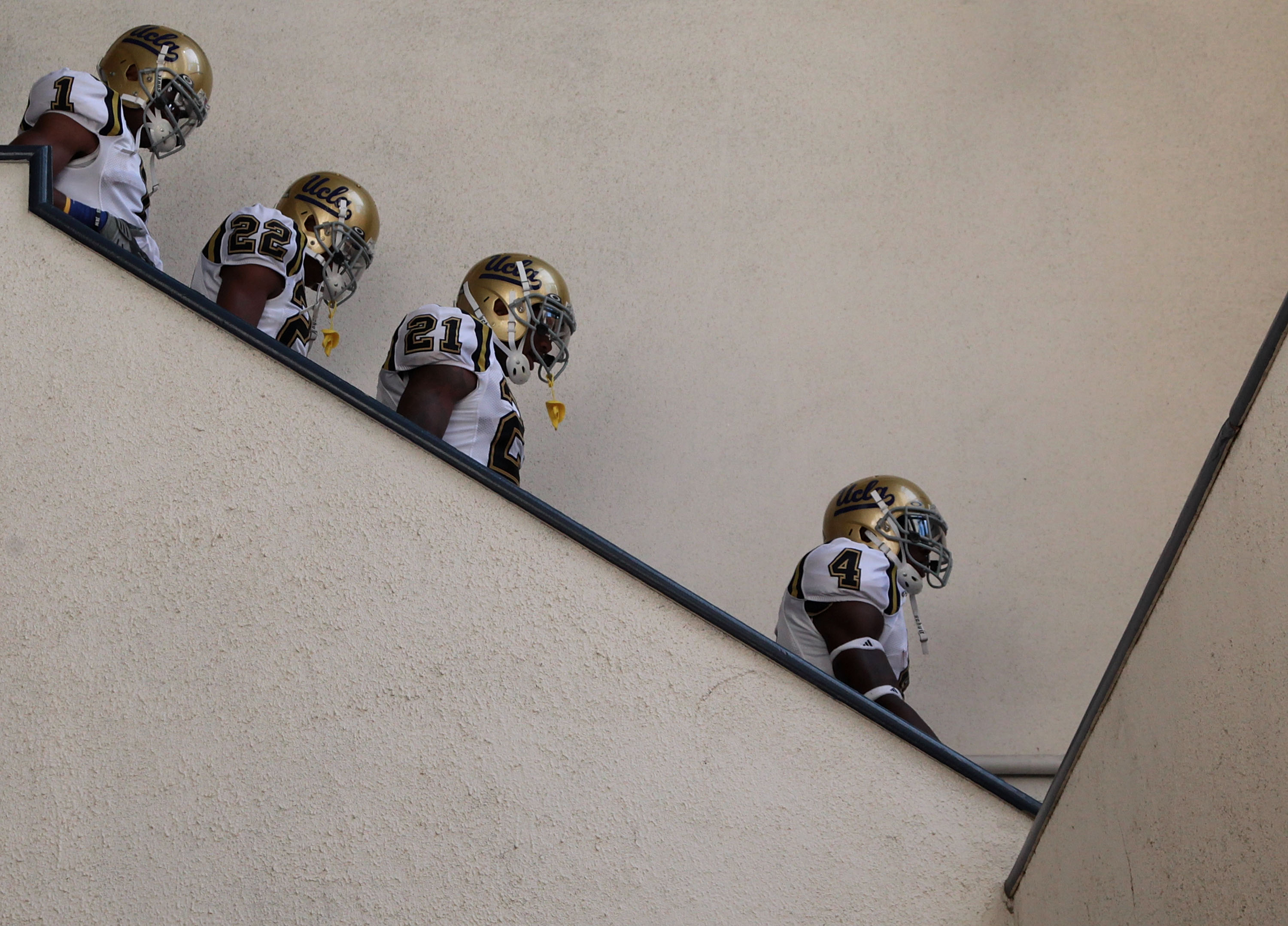 BERKELEY, CA - OCTOBER 09:  Members of the UCLA Bruins enter the field against the California Golden Bears at California Memorial Stadium on October 9, 2010 in Berkeley, California.  (Photo by Jed Jacobsohn/Getty Images)