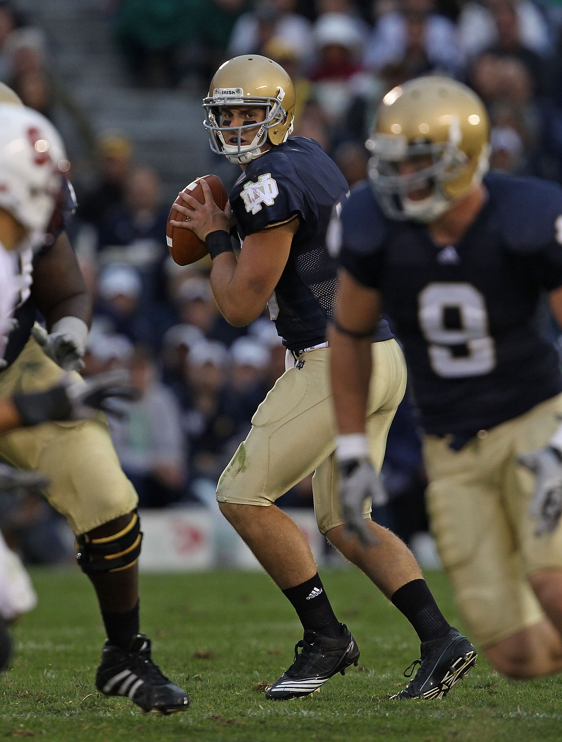 SOUTH BEND, IN - SEPTEMBER 25: Dayne Crist #10 of the Notre Dame Fighting Irish looks for a receiver against the Stanford Cardinal at Notre Dame Stadium on September 25, 2010 in South Bend, Indiana. Stanford defated Notre Dame 37-14. (Photo by Jonathan Da