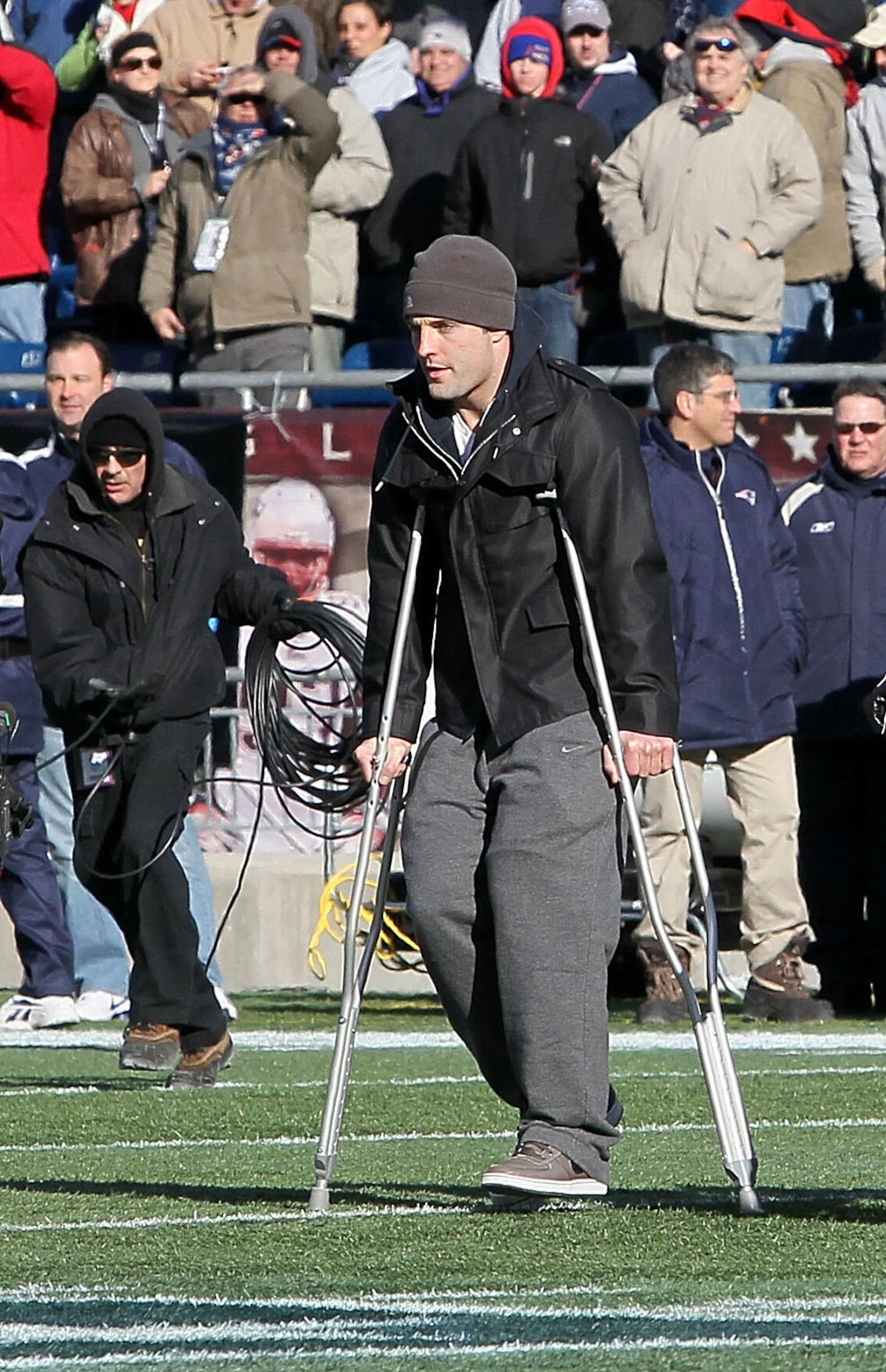 FOXBORO, MA - JANUARY 10:  Injured Wes Welker #83 of the New England Patriots walks on crutches out to midfield for the captain's meeting against the Baltimore Ravens during the 2010 AFC wild-card playoff game at Gillette Stadium on January 10, 2010 in Fo