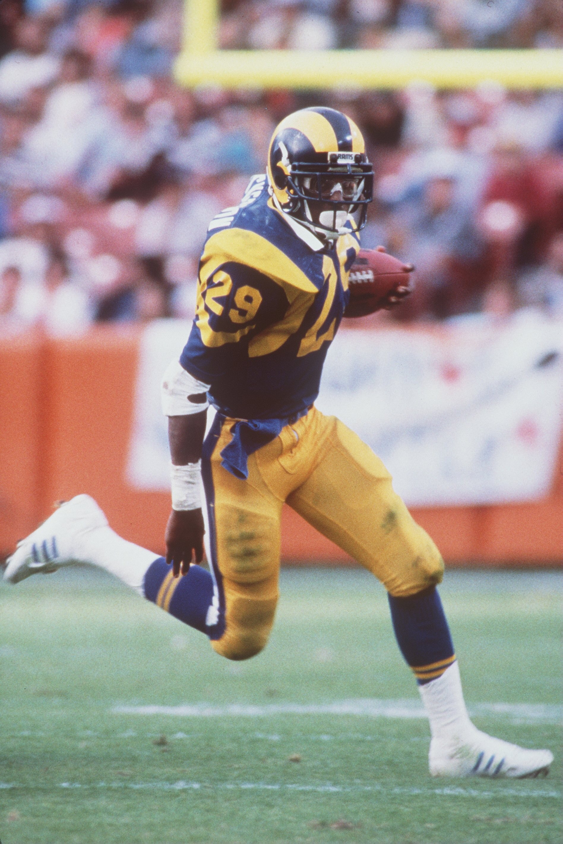 9 Dec 1984:  Running back Eric Dickerson of the Los Angeles Rams carries the football during the Rams 27-16 victory over the Houston Oilers at Anaheim Stadium in Anaheim, California.  Dickerson set the NFL record for most rushing yards in a season in 1984