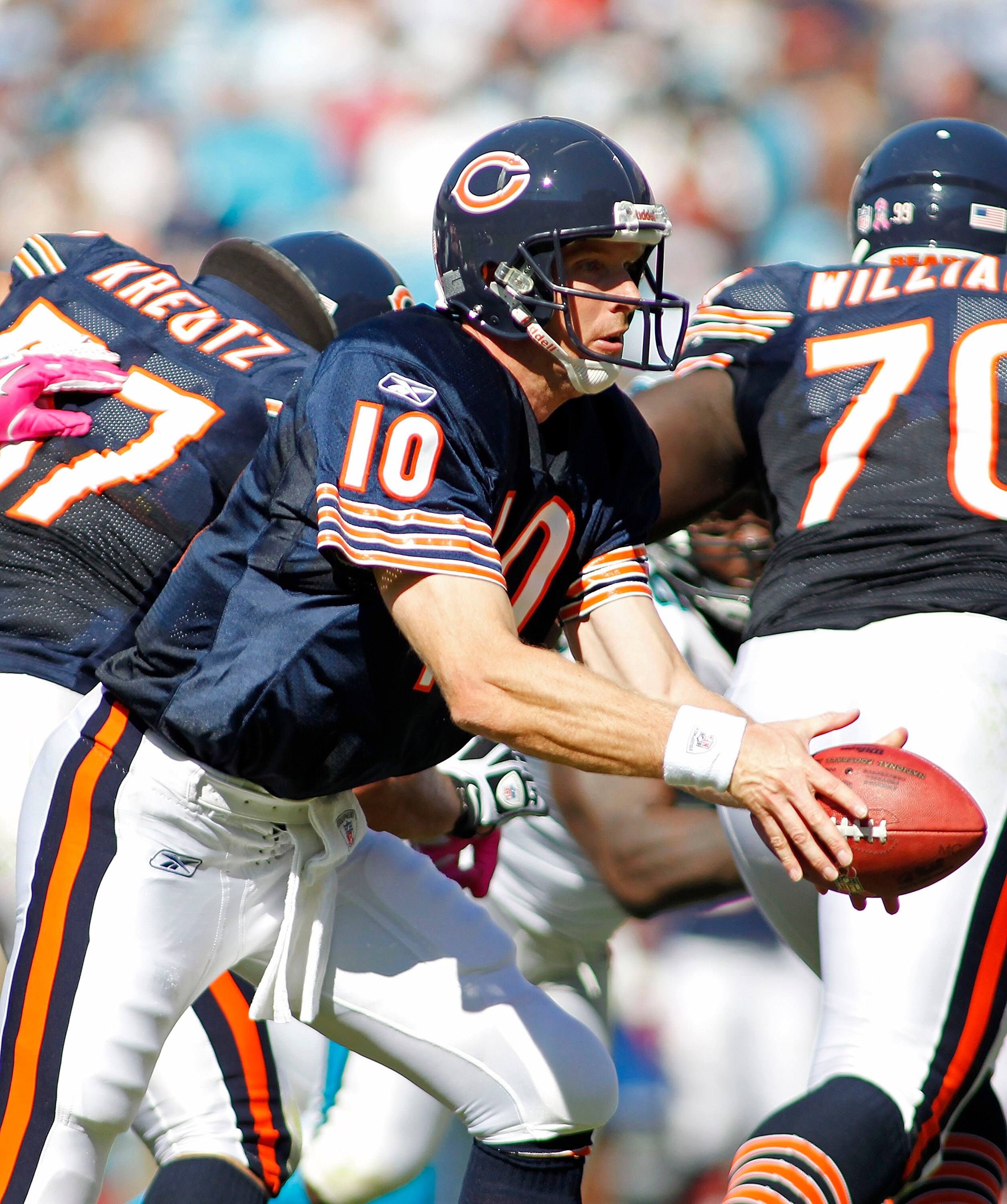 CHARLOTTE, NC - OCTOBER 10: Quarterback Todd Collins #10 of the Chicago Bears hands the ball off against the Carolina Panthers at Bank of America Stadium on October 10, 2010 in Charlotte, North Carolina. (Photo by Geoff Burke/Getty Images)