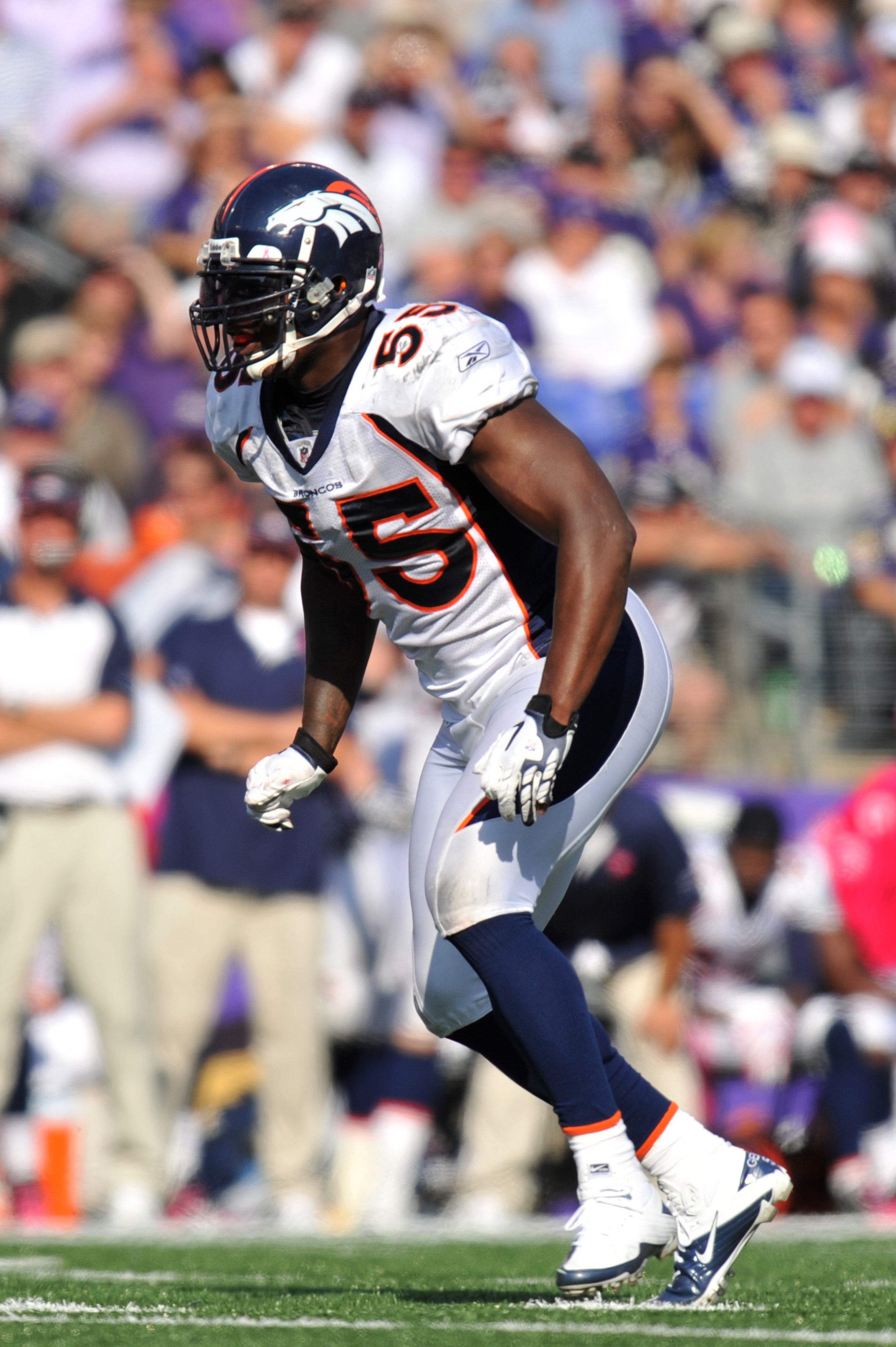 BALTIMORE, MD - OCTOBER 10: D. J. Williams #55 of the Denver Broncos defends against the Baltimore Ravens at M&T Bank Stadium on October 10, 2010 in Baltimore, Maryland. Players wore pink in recognition of Breast Cancer Awareness Month. The Ravens defeate