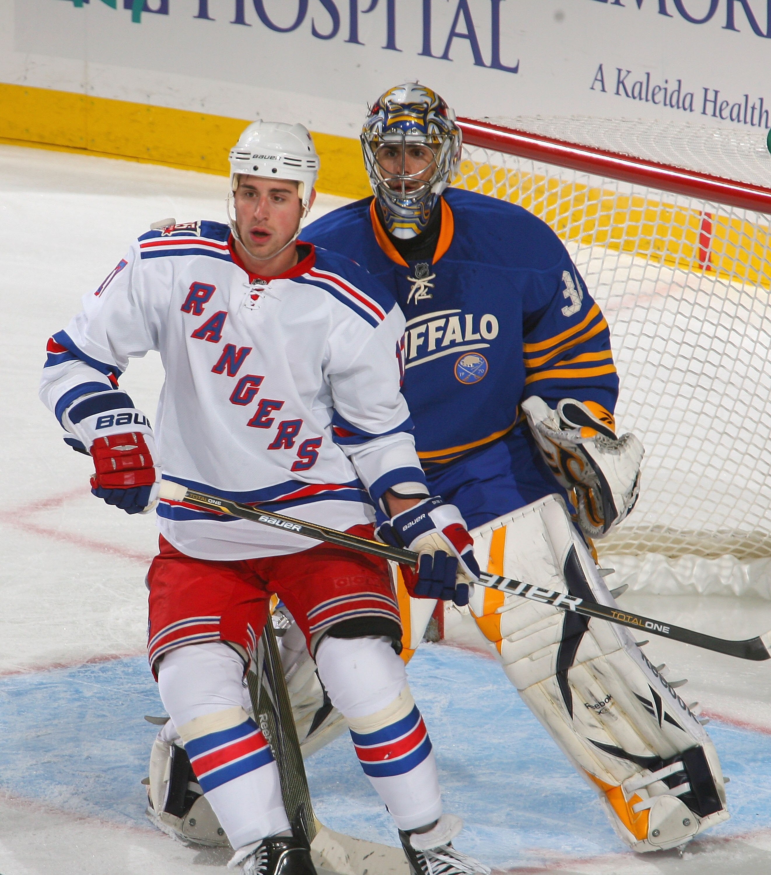 BUFFALO, NY - OCTOBER 09:  Brando Dubinsky #17 of the New York Rangers skates in front of Ryan Miller #30 of the Buffalo Sabres  at HSBC Arena on October 9, 2010 in Buffalo, New York. New York won 6-3.  (Photo by Rick Stewart/Getty Images)