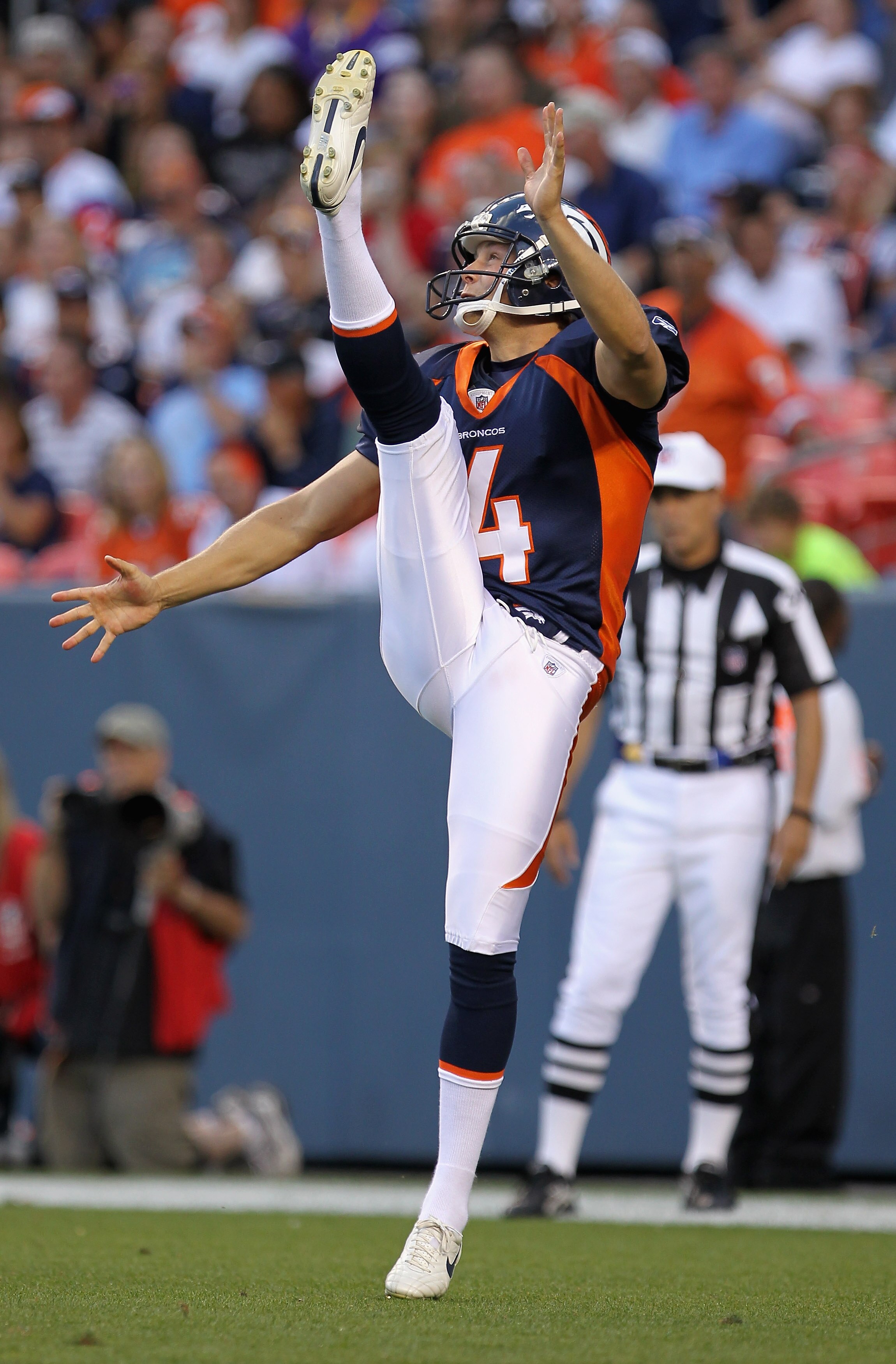 DENVER - AUGUST 29:  Punter Britton Colquitt #4 of the Denver Broncos delivers the ball to the Pittsburgh Steelers during preseason NFL action at INVESCO Field at Mile High on August 29, 2010 in Denver, Colorado.  (Photo by Doug Pensinger/Getty Images)