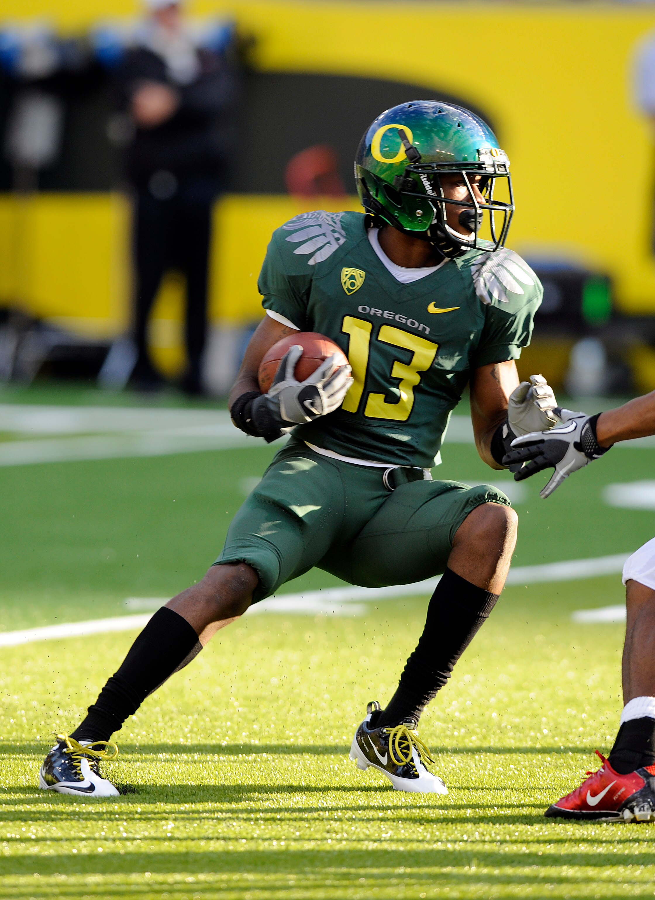 EUGENE, OR - OCTOBER 2: Cornerback Cliff Harris #13 of the Oregon Ducks runs back a kick off in the first quarter of the game against the Stanford Cardinal at Autzen Stadium on October 2, 2010 in Eugene, Oregon. Oregon won the game 52-31. (Photo by Steve 