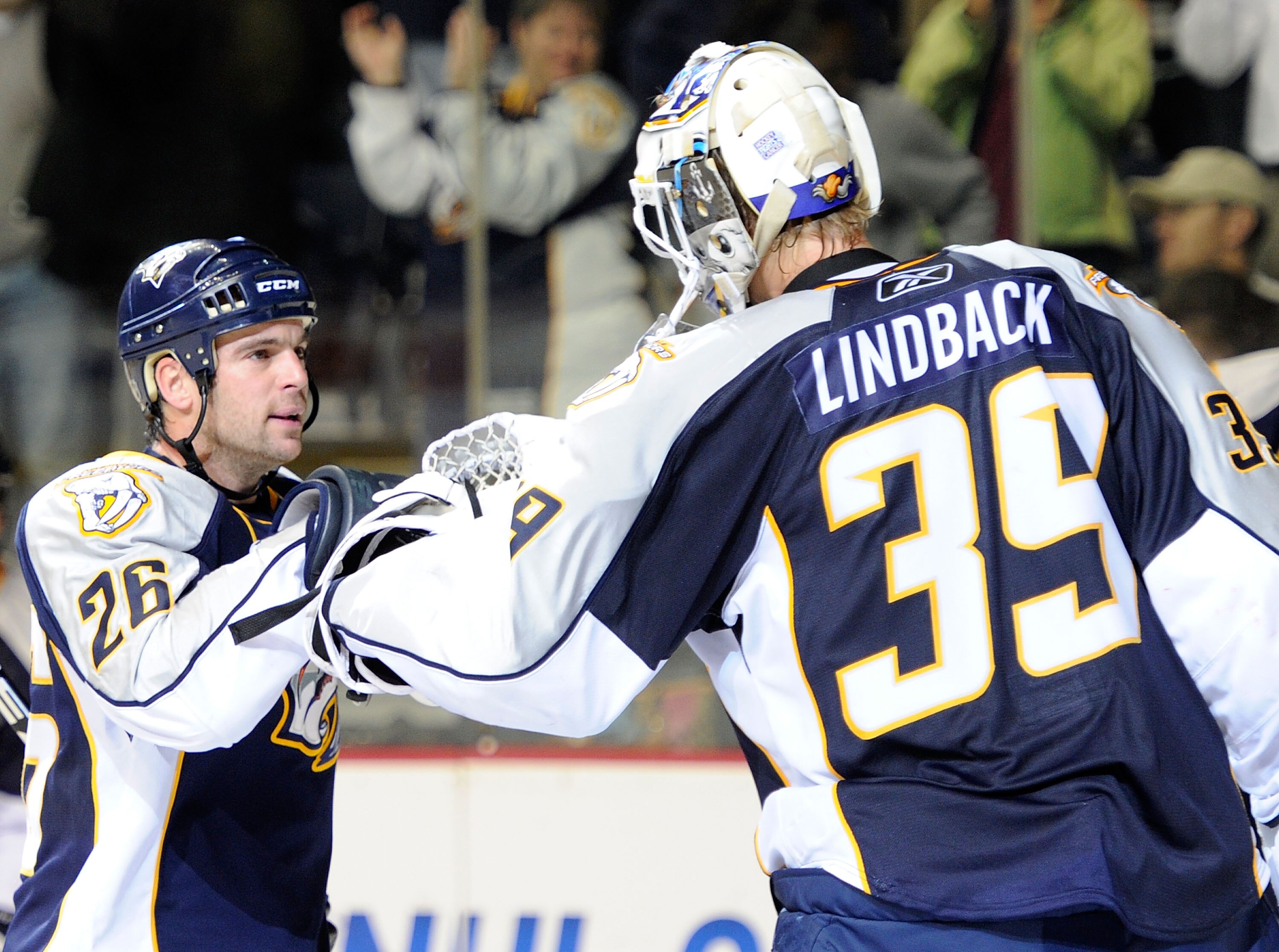 NASHVILLE, TN - OCTOBER 14:  Right wing Steve Sullivan #26 of the Nashville Predators congratulates teammate Anders Lindback #39 after defeating the St. Louis Blues on October 14, 2010 in Nashville, Tennessee.  (Photo by Frederick Breedon/Getty Images)