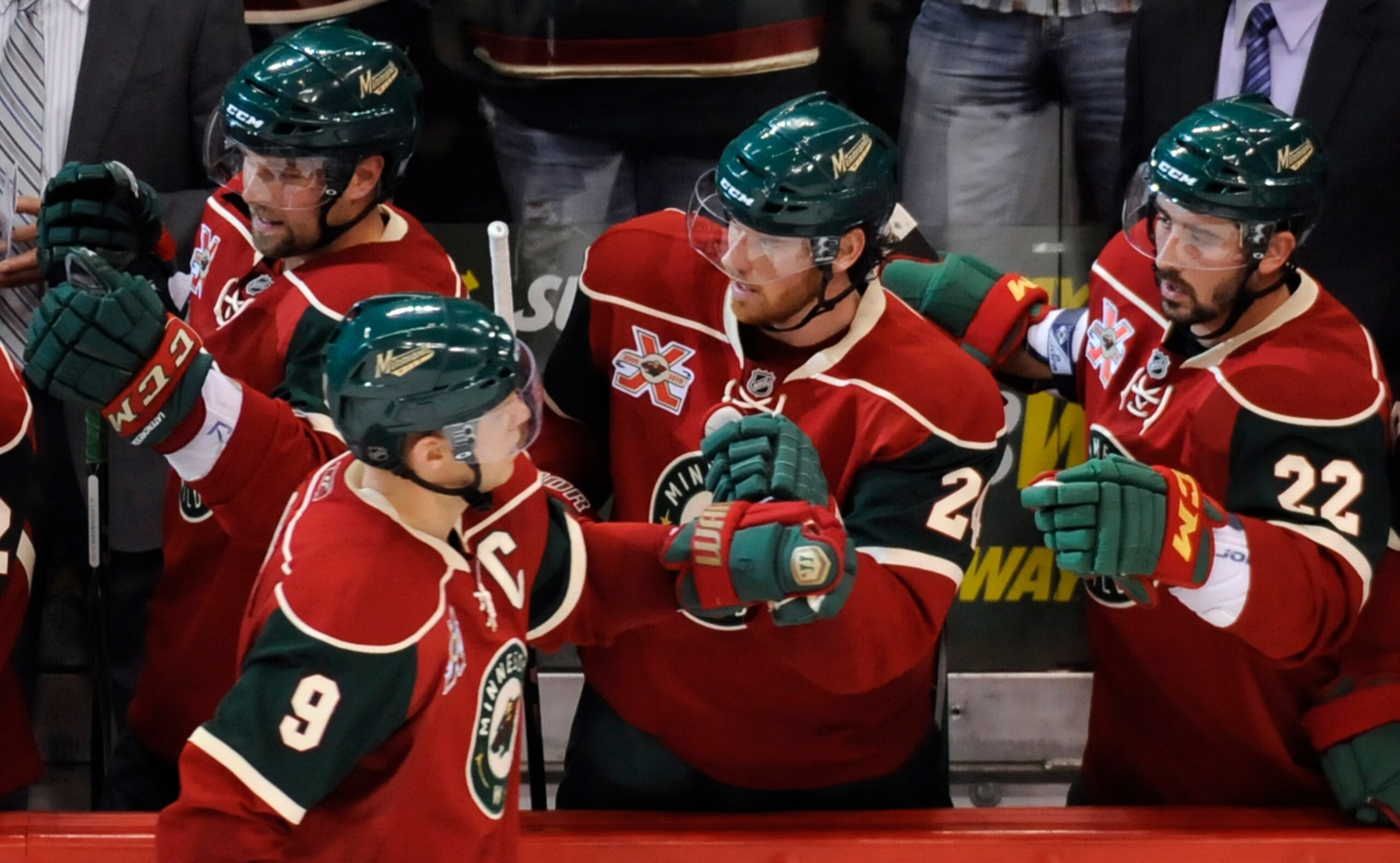 ST PAUL, MN - OCTOBER 14: Mikko Koivu #9 of the Minnesota Wild celebrates with teammates on the bench a goal scored by Matt Cullen #7 in the third period during their game against the Edmonton Oilers on October 14, 2010 at Xcel Energy Center in St Paul, M