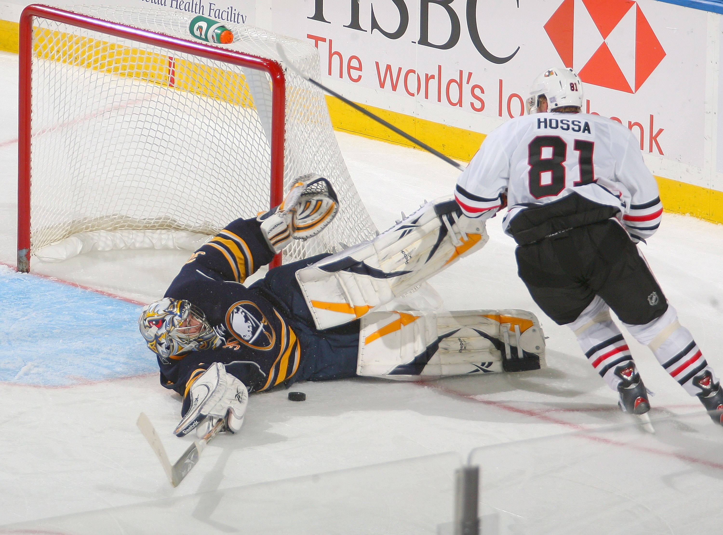 BUFFALO, NY - OCTOBER 11: Ryan Miller #30 of the Buffalo Sabres makes a sliding save on Marian Hossa #81 of the Chicago Blackhawks at HSBC Arena on October 11, 2010 in Buffalo, New York. Chicago won 4-3.  (Photo by Rick Stewart/Getty Images)