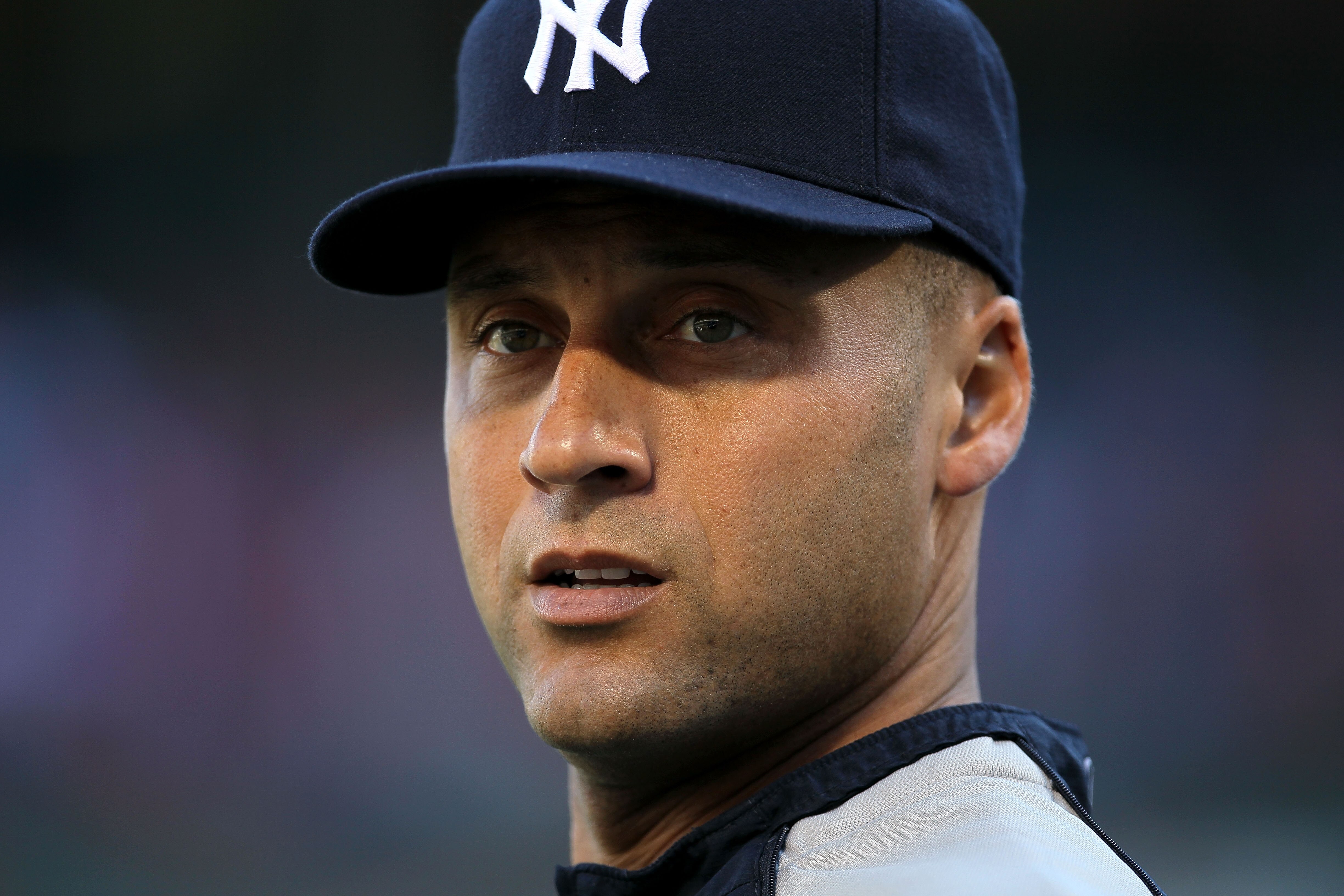 ARLINGTON, TX - OCTOBER 15:  Derek Jeter #2 of the New York Yankees looks on during batting practice against the Texas Rangers in Game One of the ALCS during the 2010 MLB Playoffs at Rangers Ballpark in Arlington on October 15, 2010 in Arlington, Texas.