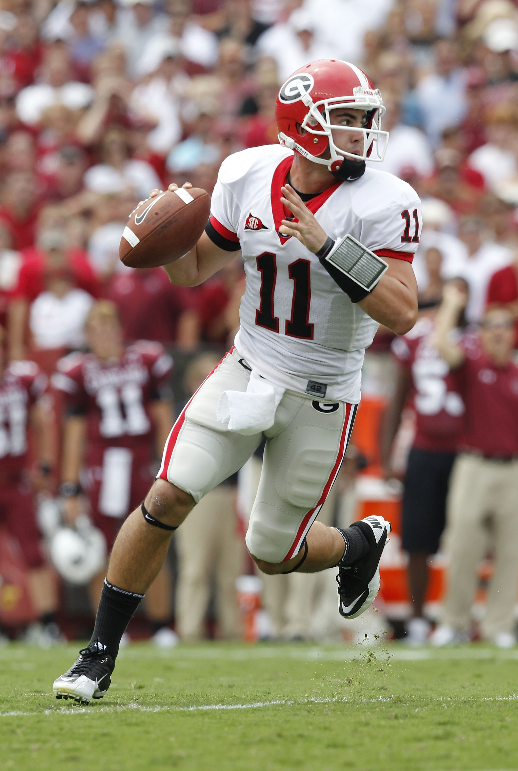 COLUMBIA, SC - SEPTEMBER 11: Quarterback Aaron Murray #11 of the Georgia Bulldogs rolls out and looks downfield to pass during the game against the South Carolina Gamecocks at Williams-Brice Stadium on September 11, 2010 in Columbia, South Carolina. The G