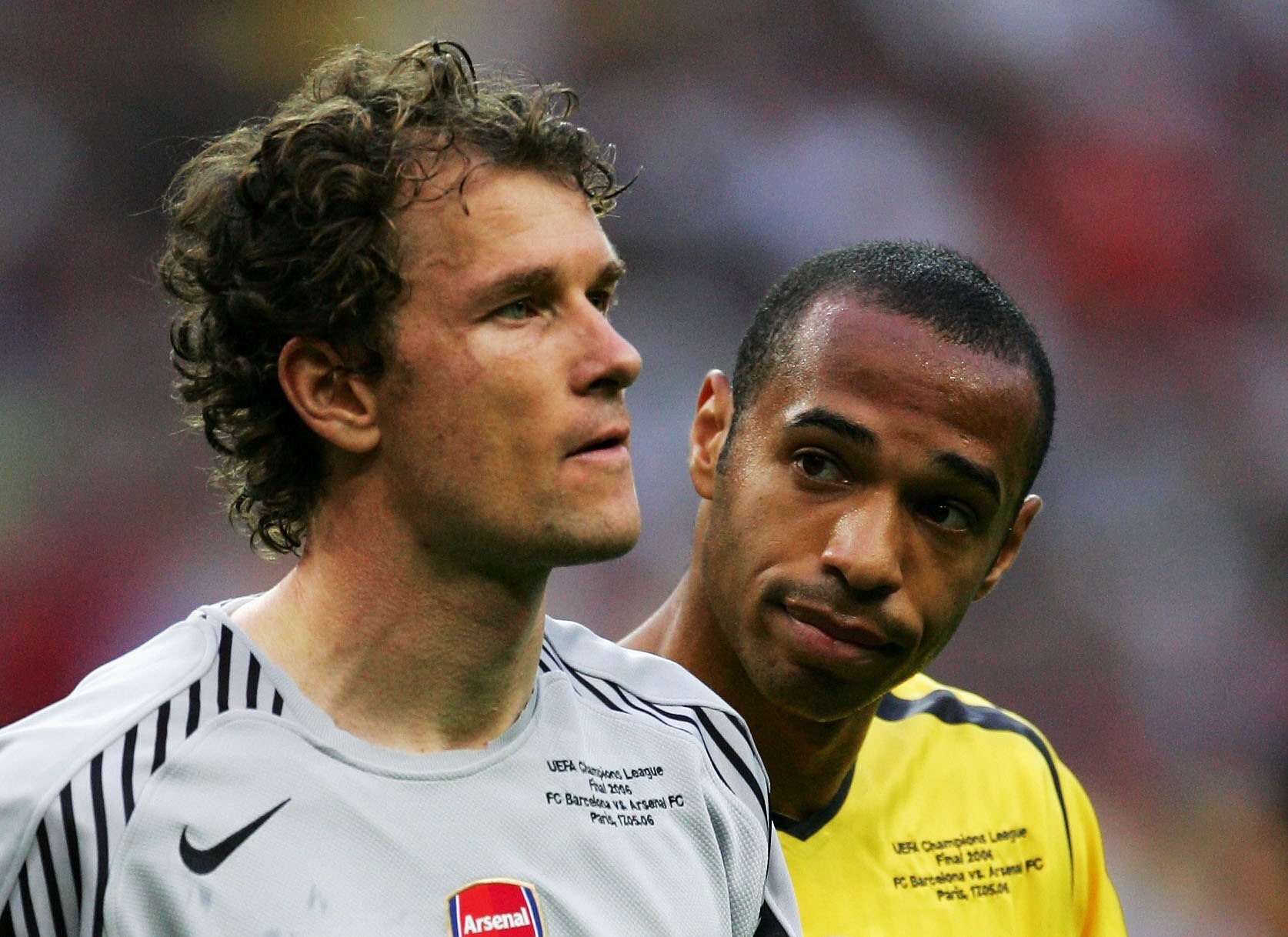 PARIS - MAY 17:  Jens Lehmann, (L) the Arsenal goalkeeper, is consoled by Thierry Henry (R) after he is sent off for fouling Samuel Eto'o of Barcelona during the UEFA Champions League Final between Arsenal and Barcelona at the Stade de France on May 17, 2
