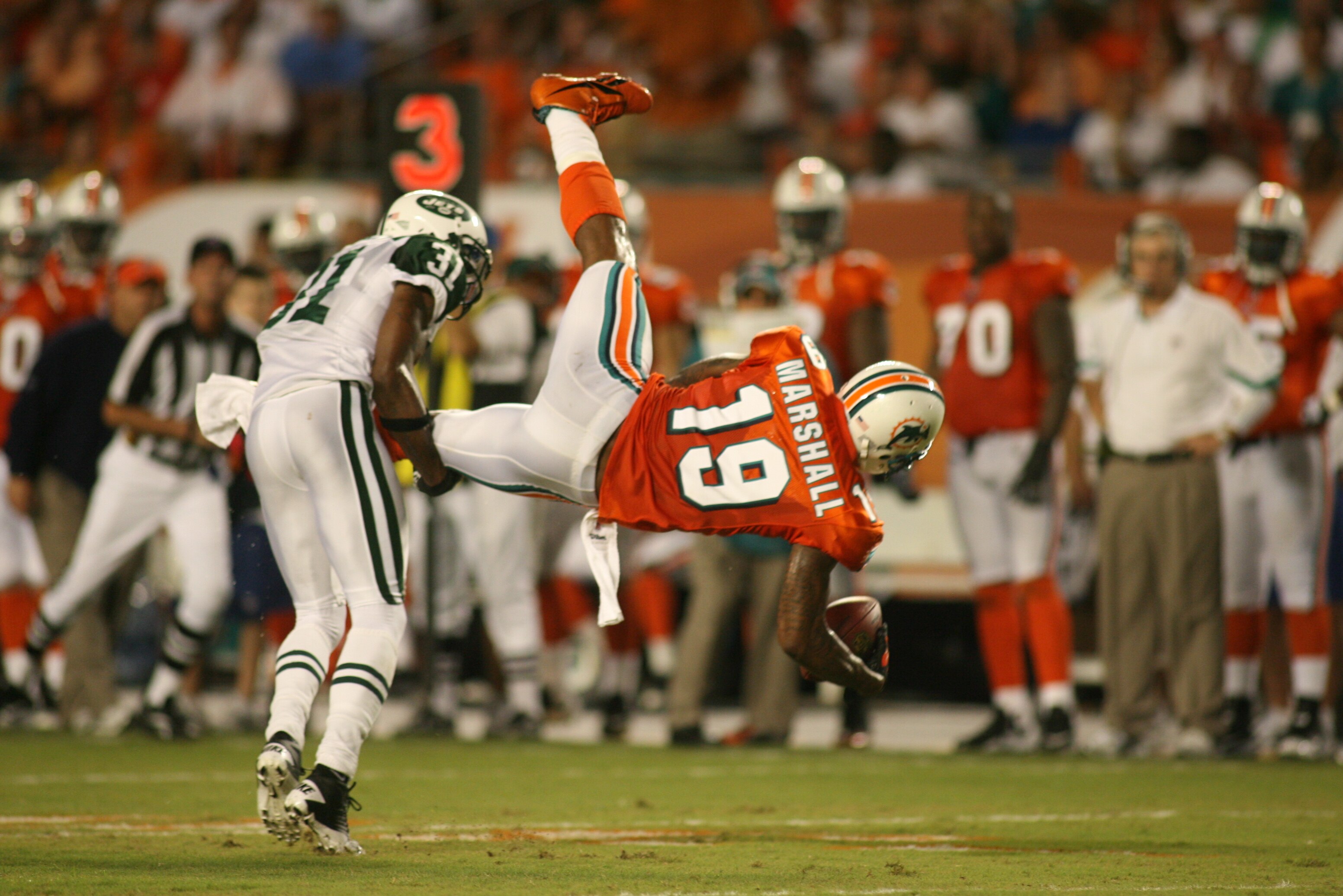 MIAMI - SEPTEMBER 26: Receiver Brandon Marshall #19 of the Miami Dolphins makes a catch against the New York Jets at Sun Life Stadium on September 26, 2010 in Miami, Florida. The Jets won 31-23. (Photo by Marc Serota/Getty Images)