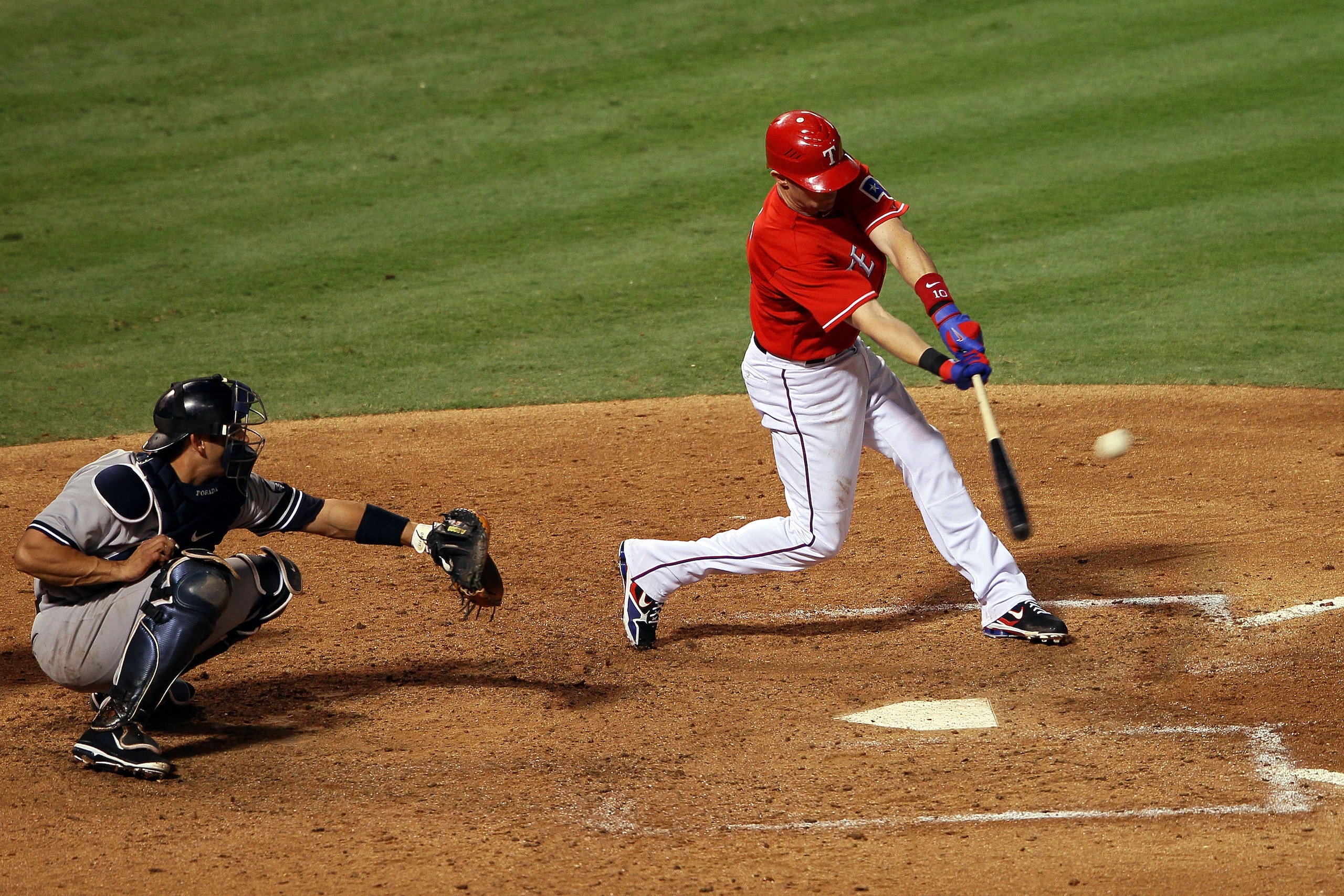 ARLINGTON, TX - OCTOBER 15:   Michael Young #10 of the Texas Rangers hits a two run RBI in the fourth inning against the New York Yankees in Game One of the ALCS during the 2010 MLB Playoffs at Rangers Ballpark in Arlington on October 15, 2010 in Arlingto