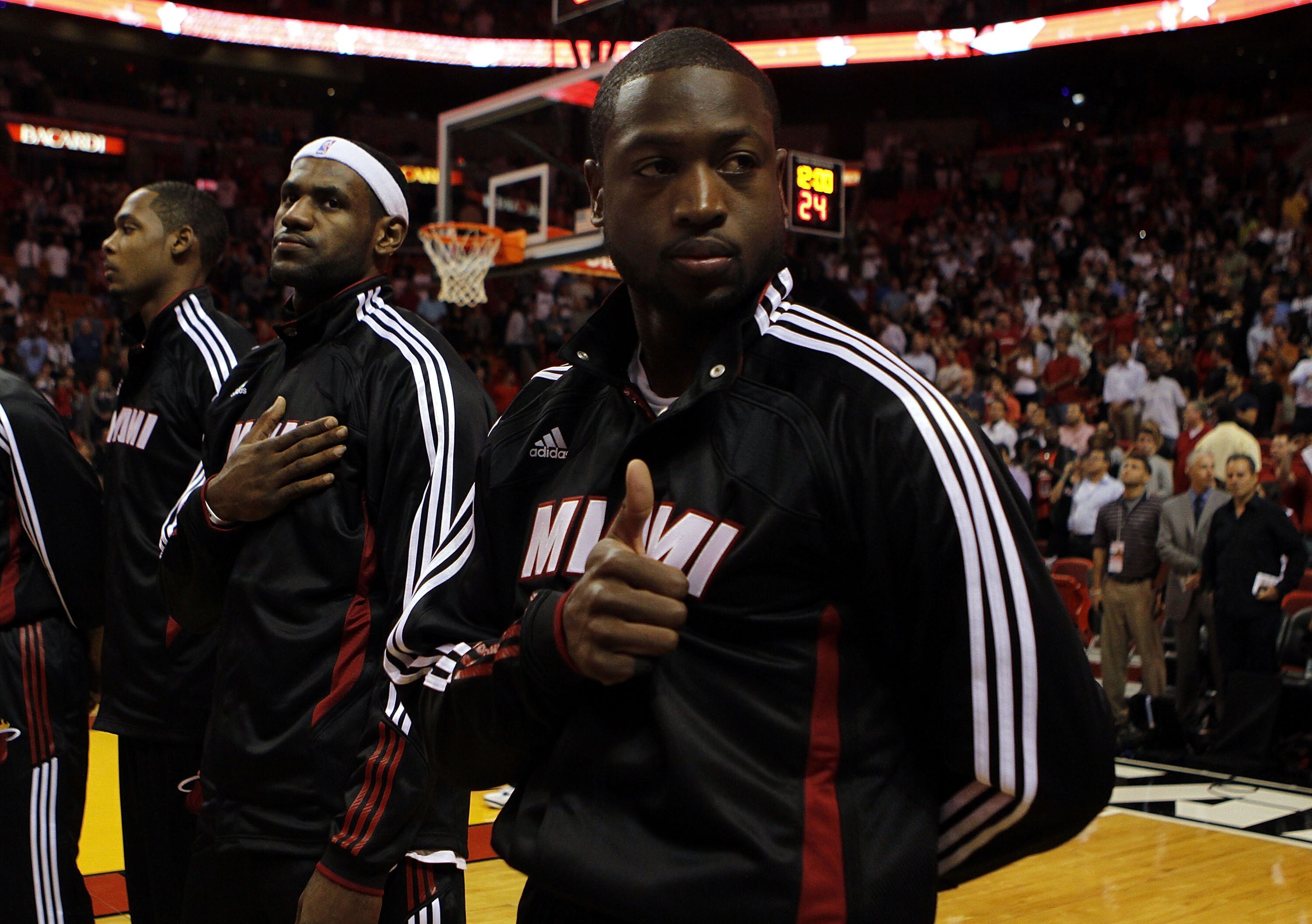 MIAMI - OCTOBER 05:  Forward LeBron James #6 (C) and teammate Dwyane Wade #3 (R) on the court before taking on the Detroit Pistons on October 5, 2010 in Miami, Florida.  NOTE TO USER: User expressly acknowledges and agrees that, by downloading and or usin