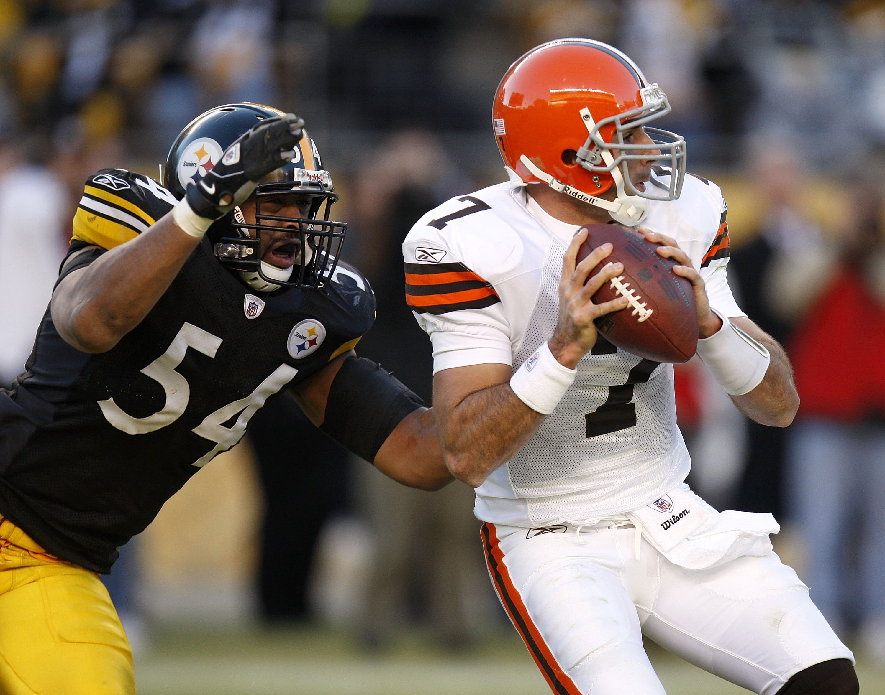 PITTSBURGH - DECEMBER 28:  Bruce Gradkowski #7 of the Cleveland Browns gets sacked by Andre Frazier #54 of the Pittsburgh Steelers during the fourth quarter at Heinz Field December 28, 2008 in Pittsburgh, Pennsylvania. Pittsburgh won the game 31-0.  (Phot