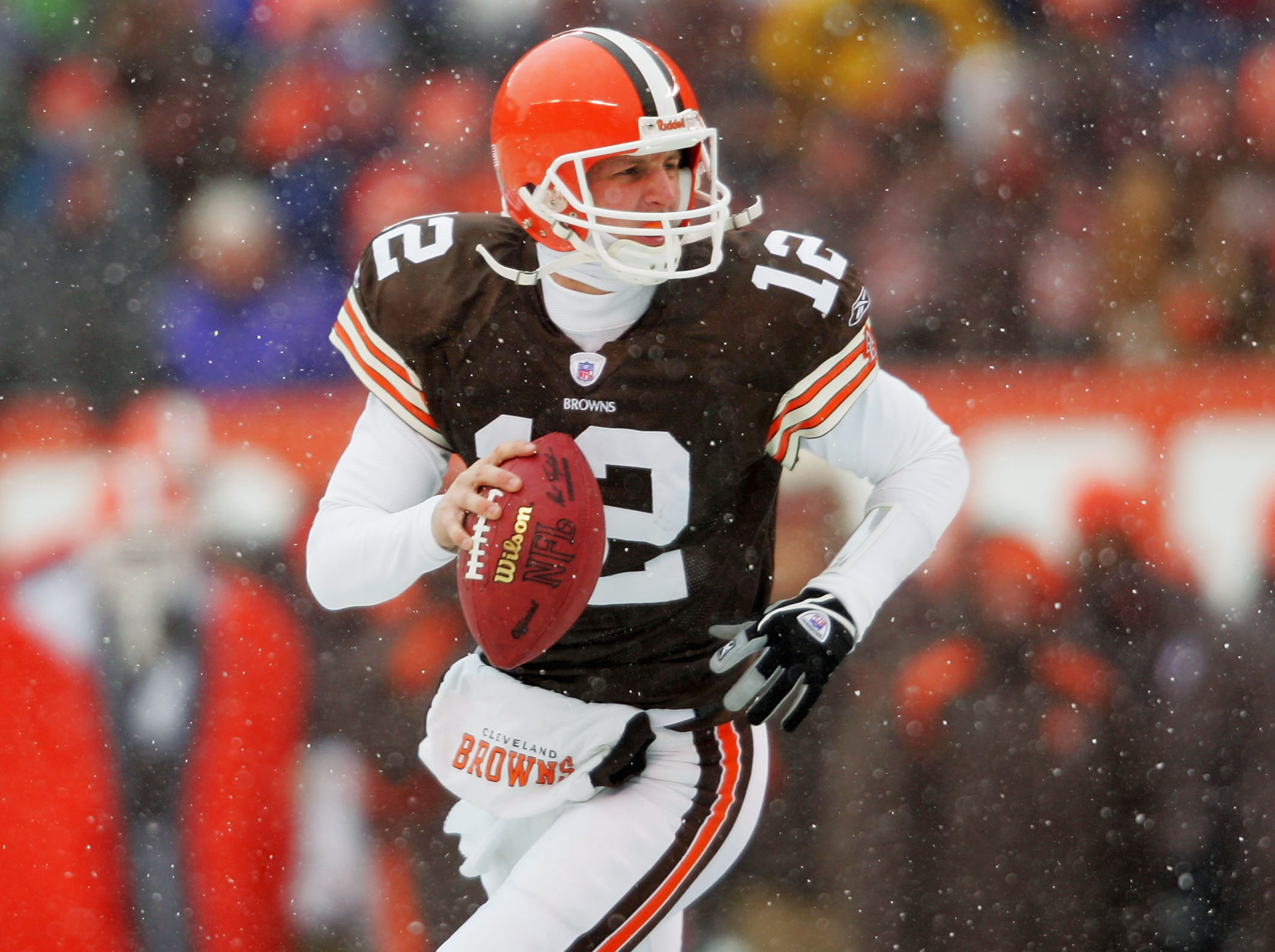 CLEVELAND - DECEMBER 19:  Luke McCown #12 of the Cleveland Browns rolls out of the pocket against the San Diego Chargers December 19, 2004 at Cleveland Browns Stadium in Cleveland, Ohio.  (Photo by Matthew Stockman/Getty Images)