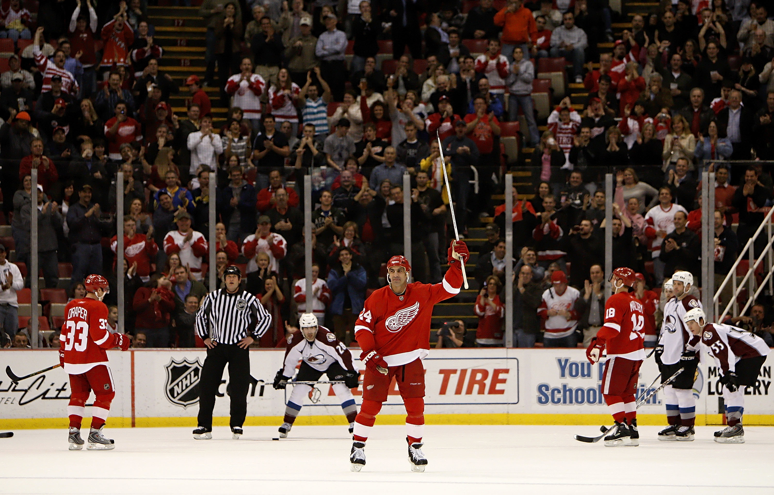 DETROIT - JANUARY 08:  Chris Chelios #24 of the Detroit Red Wings waves to fans after being announced as the second oldest player to play in a NHL game while playing the Colorado Avalanche on January 8, 2008 at Joe Louis Arena in Detroit, Michigan.  (Phot