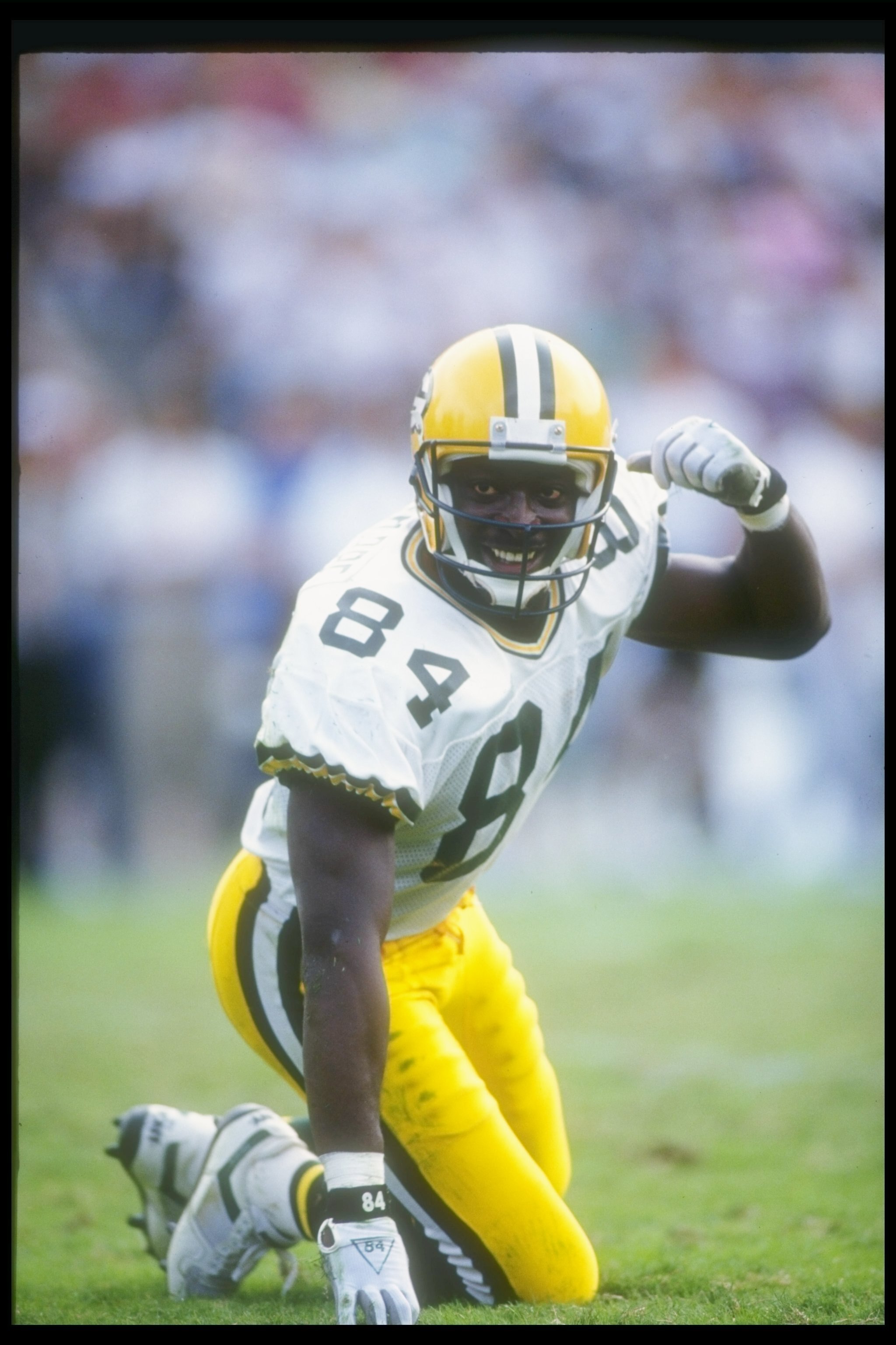 11 Nov 1990:  Wide receiver Sterling Sharpe of the Green Bay Packers gets up off the turf during a game against the Los Angeles Raiders at the Los Angeles Memorial Coliseum in Los Angeles, California.  The Packers won the game, 29-16. Mandatory Credit: Ot
