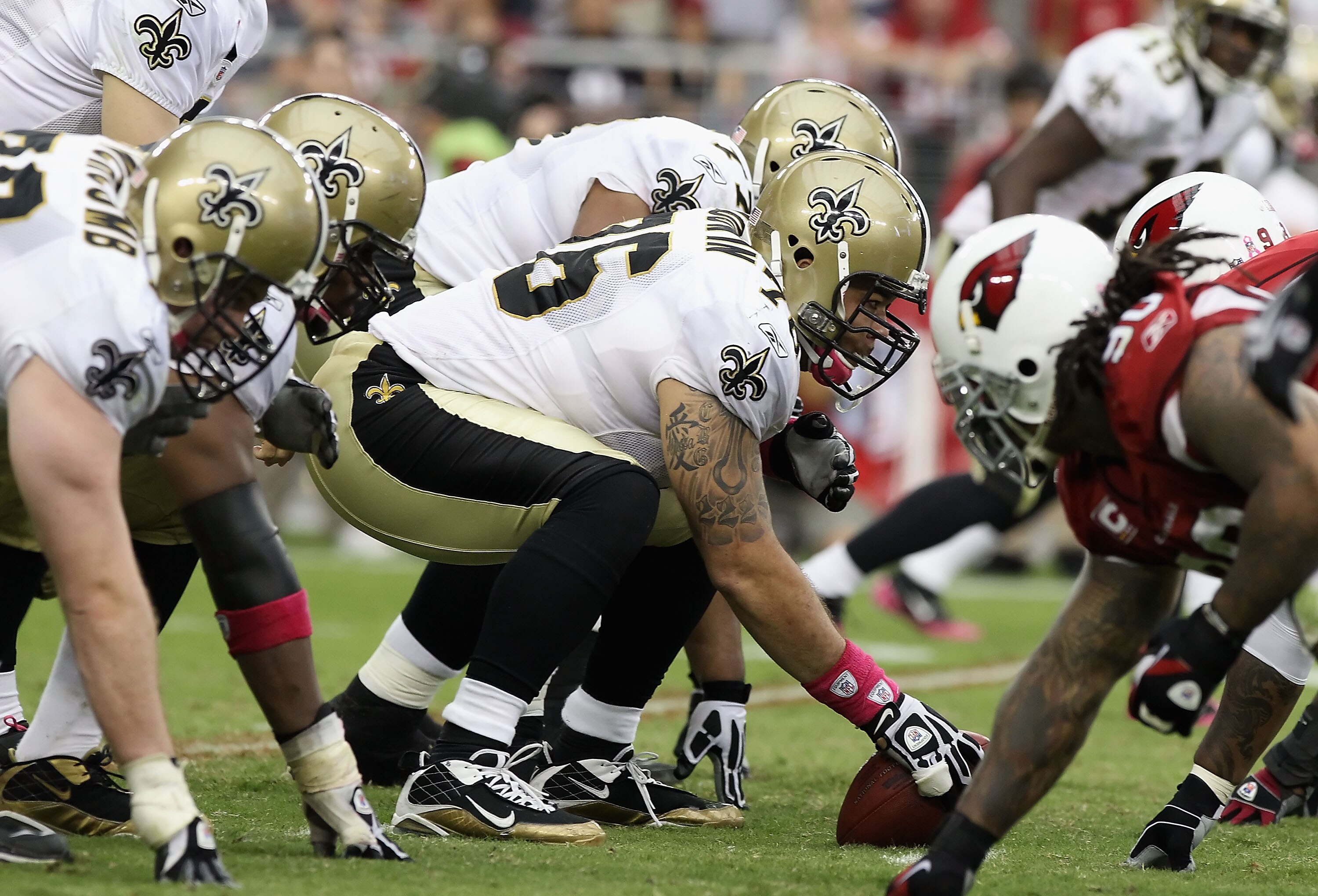 GLENDALE, AZ - OCTOBER 10:  Center Jonathan Goodwin #76 of the New Orleans Saints prepares to snap the football during the NFL game against the Arizona Cardinals at the University of Phoenix Stadium on October 10, 2010 in Glendale, Arizona. The Cardinals