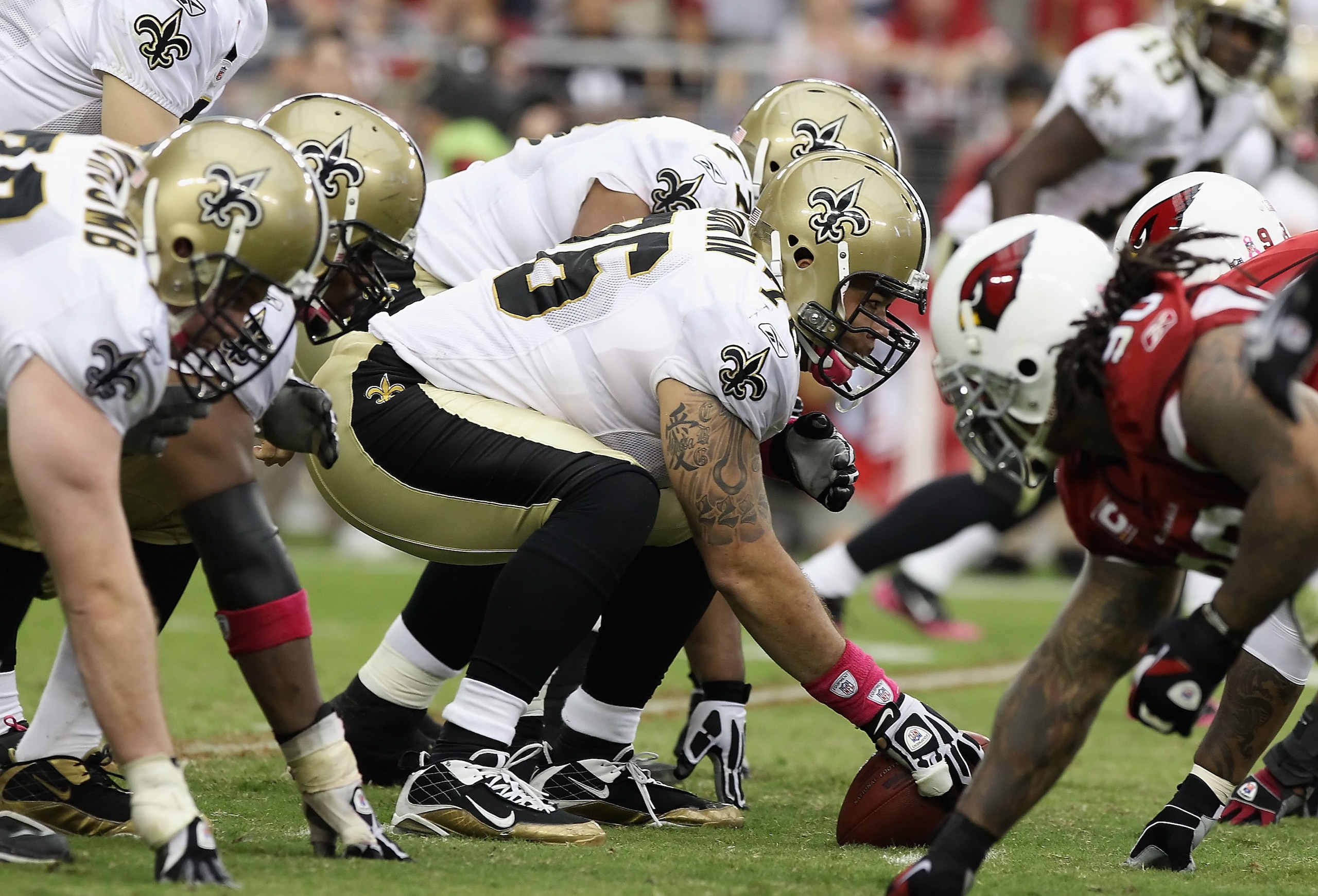 GLENDALE, AZ - OCTOBER 10:  Center Jonathan Goodwin #76 of the New Orleans Saints prepares to snap the football during the NFL game against the Arizona Cardinals at the University of Phoenix Stadium on October 10, 2010 in Glendale, Arizona. The Cardinals