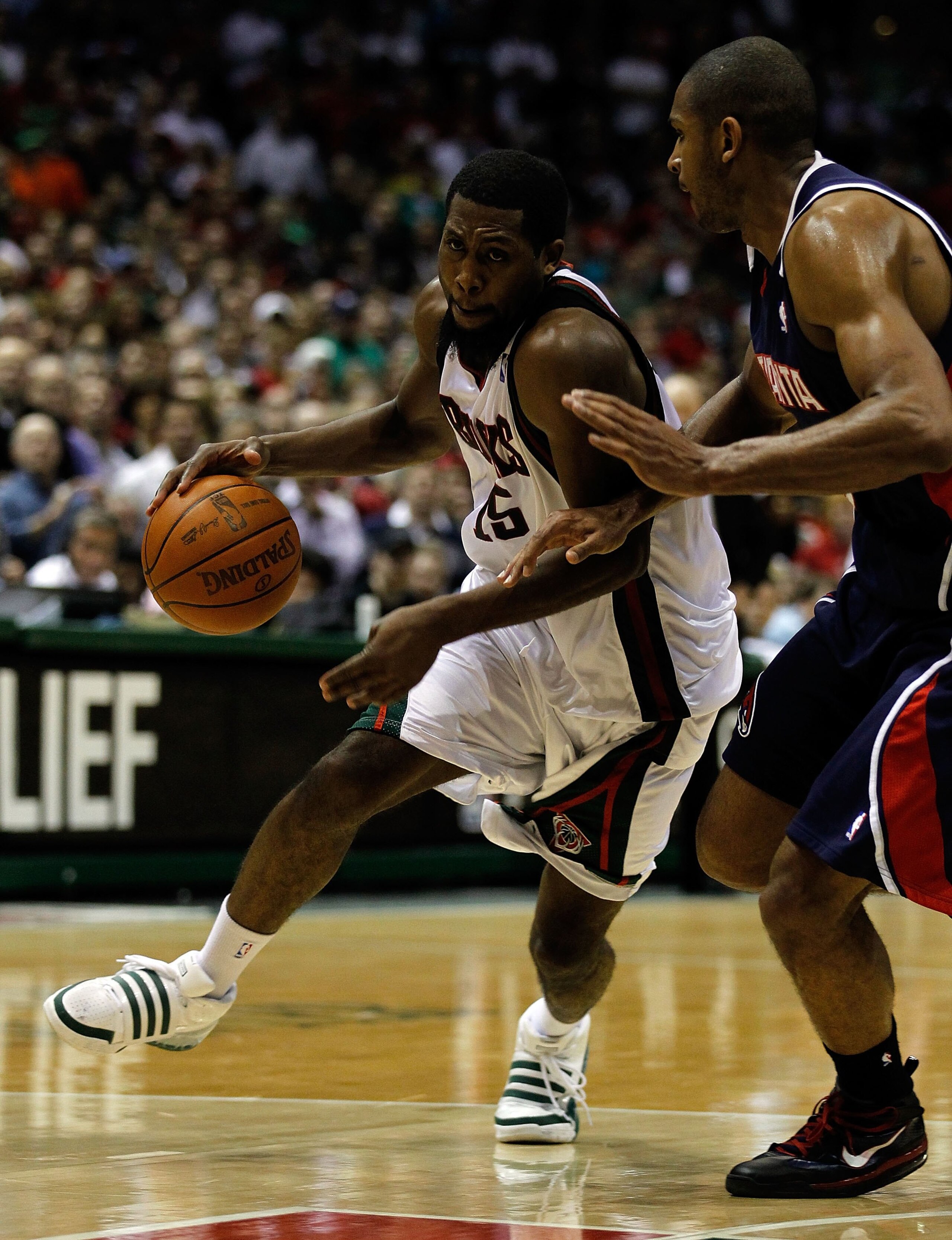 MILWAUKEE - APRIL 26: John Salmons #15 of the Milwaukee Bucks drives against Al Horford #15 of the Atlanta Hawks in Game Four of the Eastern Conference Quarterfinals during the 2010 NBA Playoffs at the Bradley Center on April 26, 2010 in Milwaukee, Wiscon