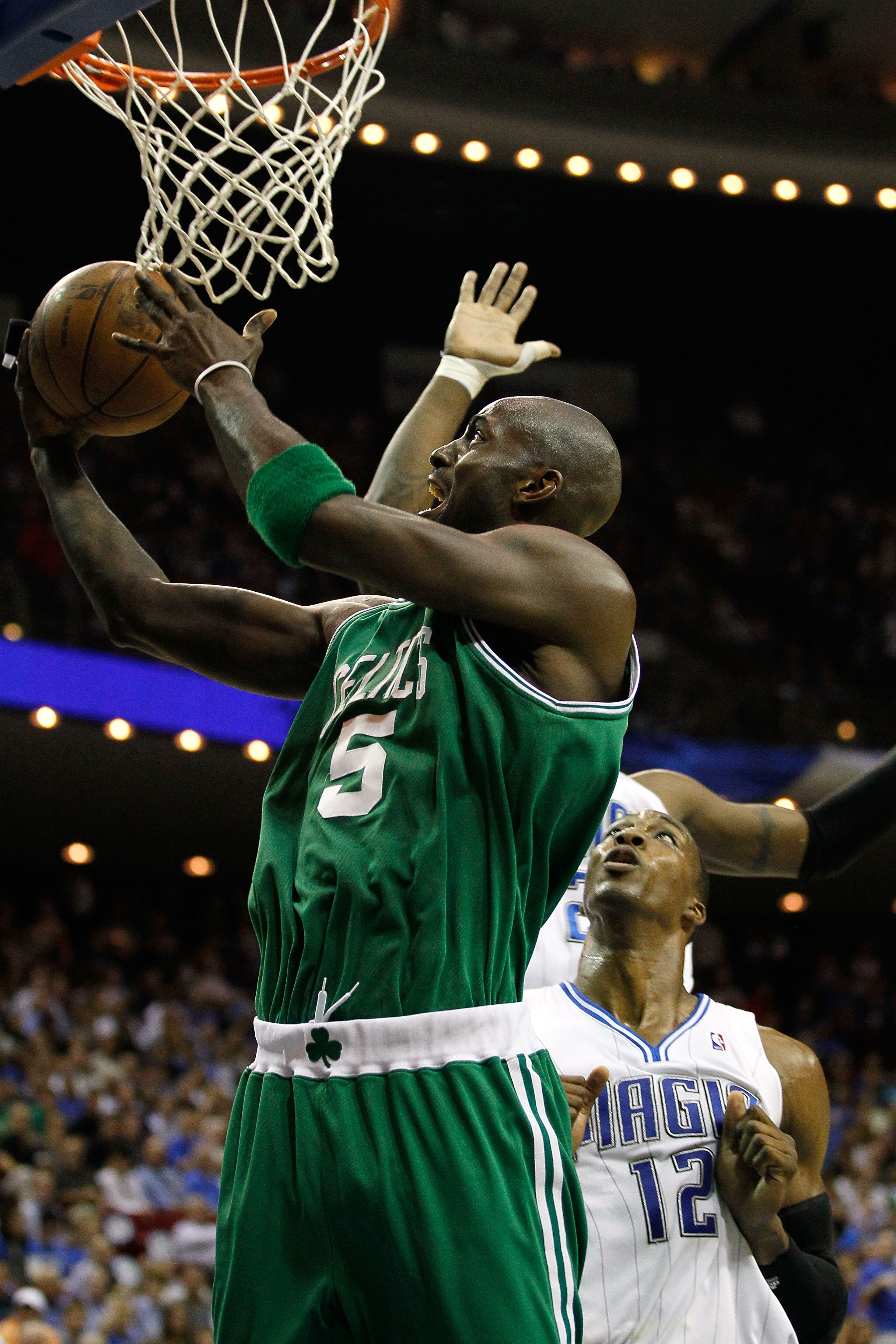 ORLANDO, FL - MAY 26:  Kevin Garnett #5 of the Boston Celtics drives for a shot attempt against Dwight Howard #12 of the Orlando Magic in Game Five of the Eastern Conference Finals during the 2010 NBA Playoffs at Amway Arena on May 26, 2010 in Orlando, Fl