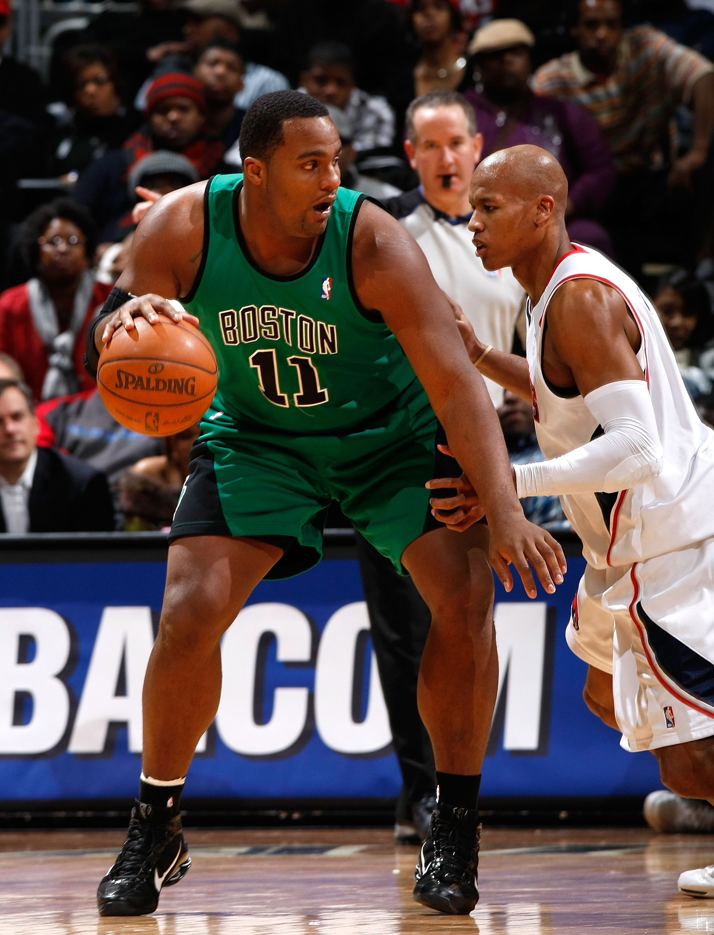 ATLANTA - JANUARY 08:  Glen Davis #11 of the Boston Celtics against Maurice Evans #1 of the Atlanta Hawks at Philips Arena on January 8, 2010 in Atlanta, Georgia.  NOTE TO USER: User expressly acknowledges and agrees that, by downloading and/or using this